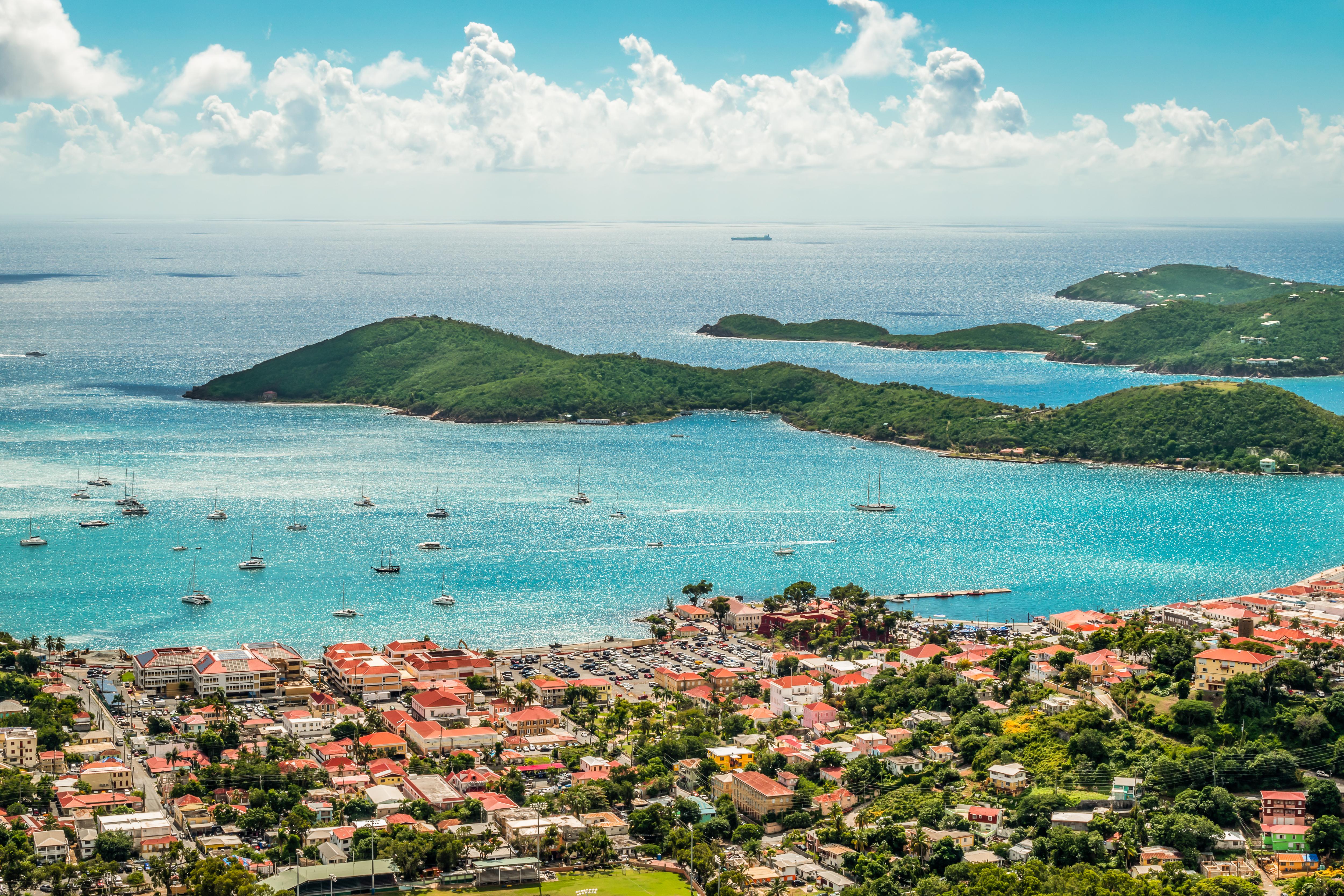 Aerial view of Charlotte Amalie, St. Thomas, US Virgin Islands—historic harbor city framed by green hills, clear waters, and cruise port charm in the heart of the Caribbean | Fraser Yachts