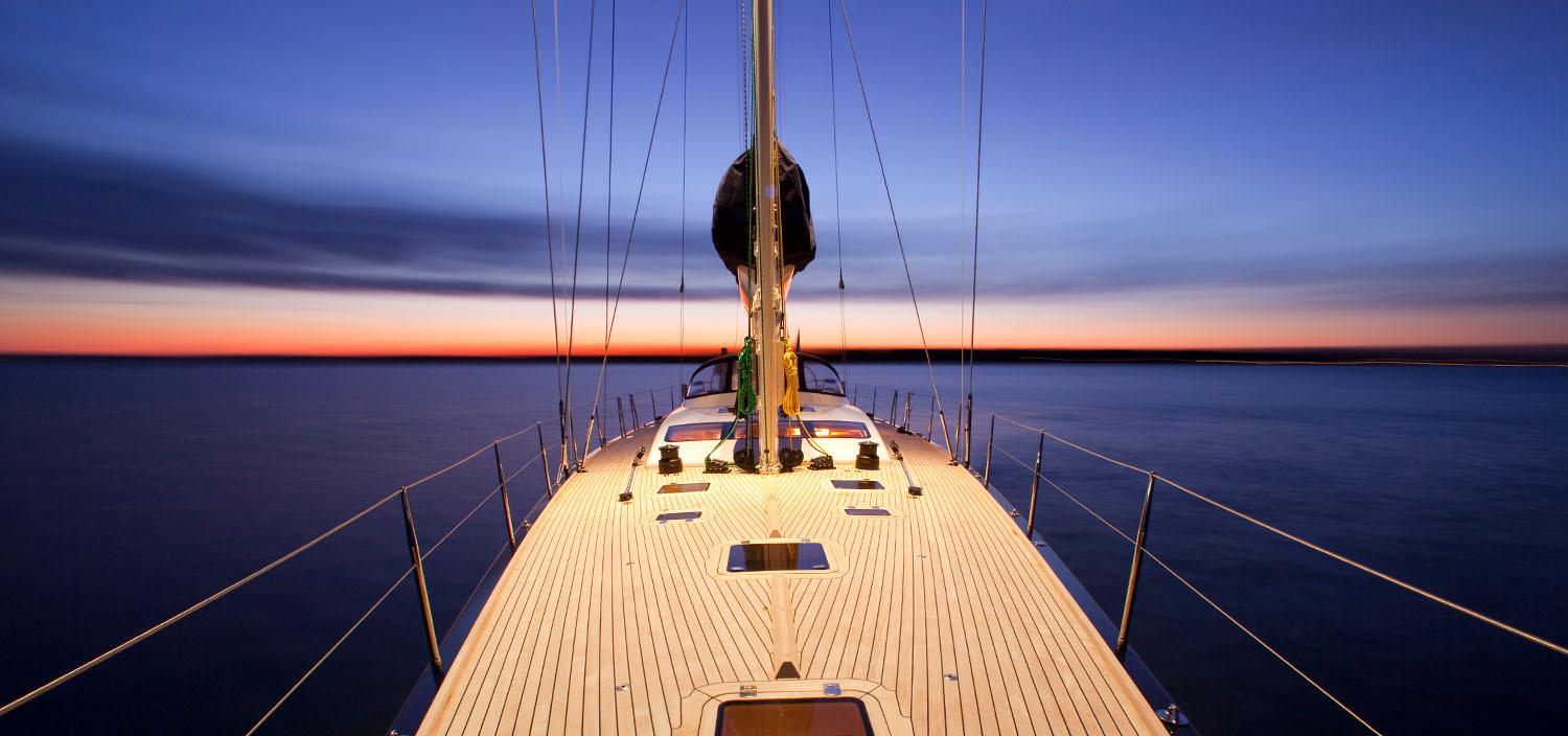 The elegant main deck of the Sedna yacht, designed by German Frers, featuring stylish outdoor seating and breathtaking views. | yacht main deck, luxury yacht design, German Frers yacht, Sedna yacht | Fraser Yachts