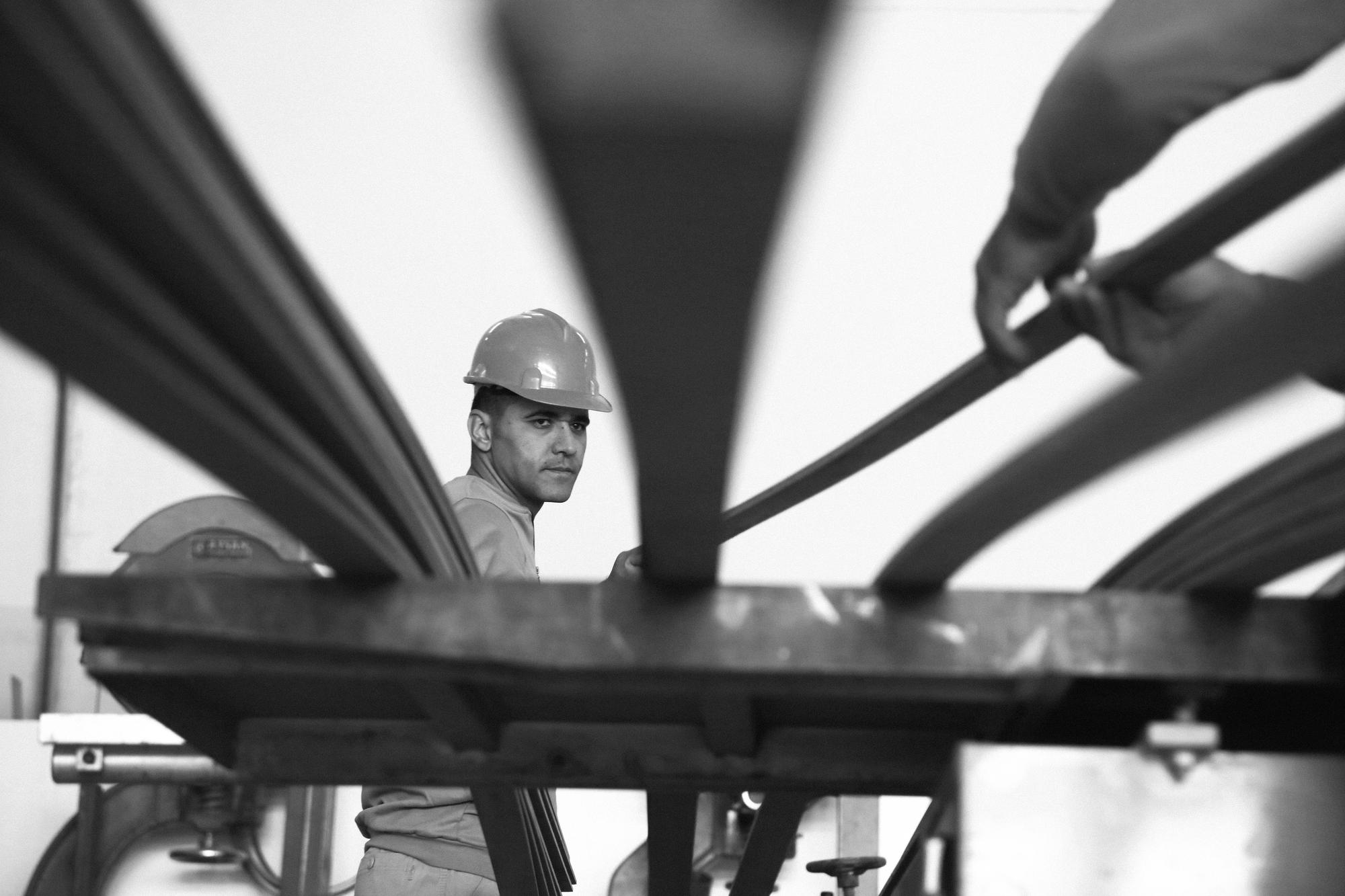 A skilled builder working on the rails of a yacht during the construction process at Ameller Build. | yacht construction, boat building, Ameller Build, yacht rails | Fraser Yachts