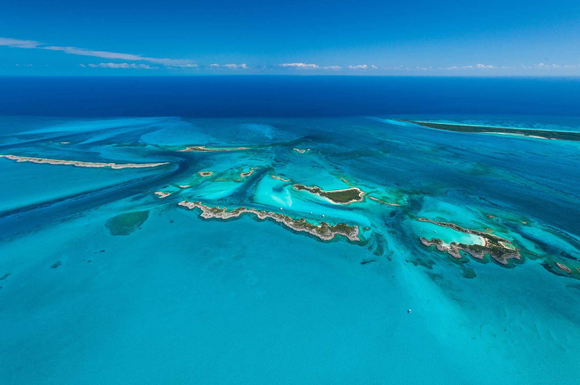 Experience the aerial view of the stunning beaches and blue waters of the Exumas, a true paradise in the Bahamas | Aerial view, beach, blue, beautiful, paradise, Exumas | FRASER