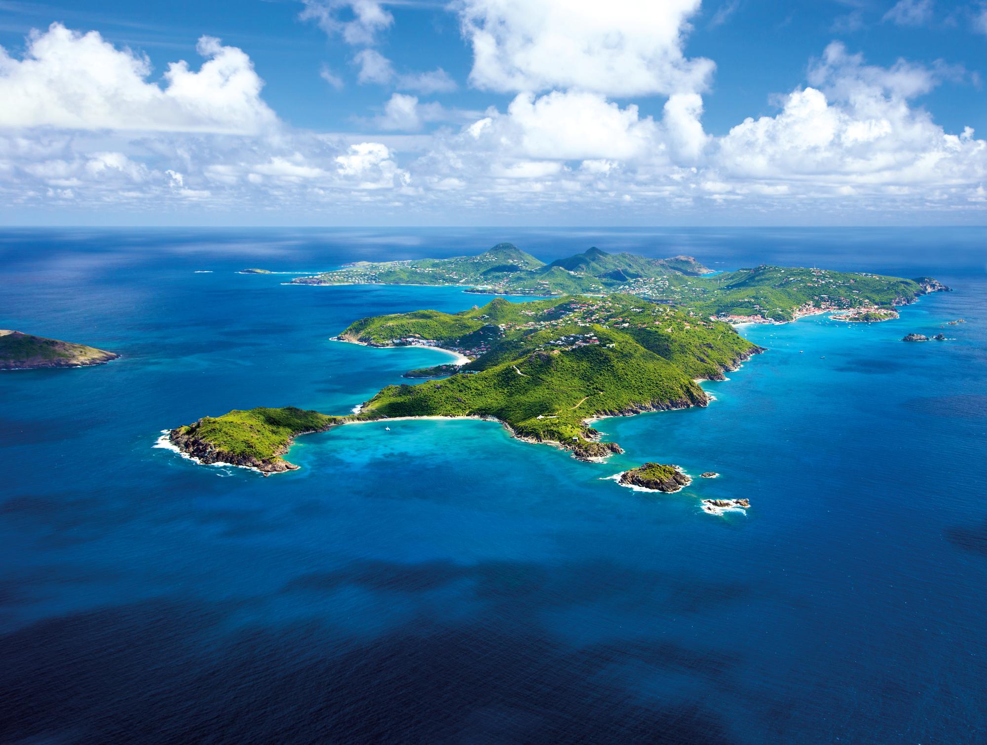 Experience the stunning beauty and luxury of St. Barths in the Caribbean with Fraser Yachts. | Caribbean, St. Barths, lagoon, aerial view, Antilles yacht charter | Fraser