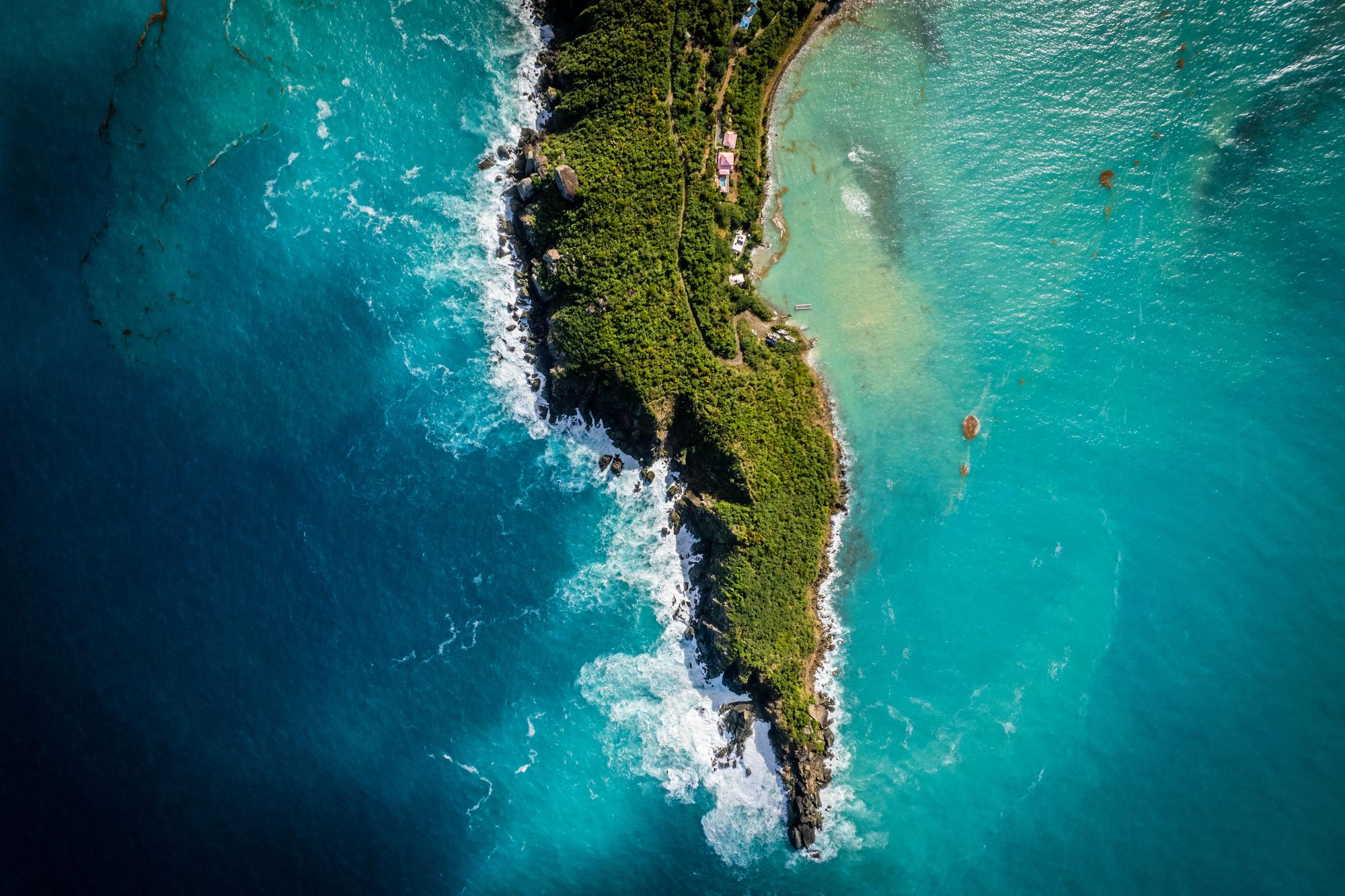 Experience the beauty of Tortola from an aerial perspective, with its stunning views of the island, sea surface, and rolling waves | Aerial, island, sea, surface, travel, waves, Tortola, British Virgin Islands | FRASER