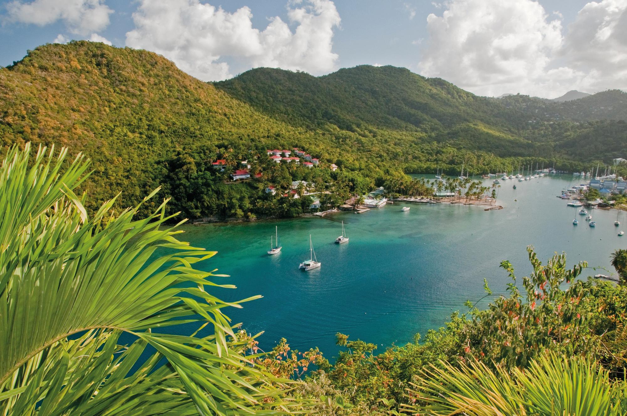 Experience the thrill of watersports in Marigot Bay, Saint Lucia, with Fraser Yachts. | Caribbean, Saint Lucia, Marigot Bay, sailboat, watersports, yacht charter | Fraser