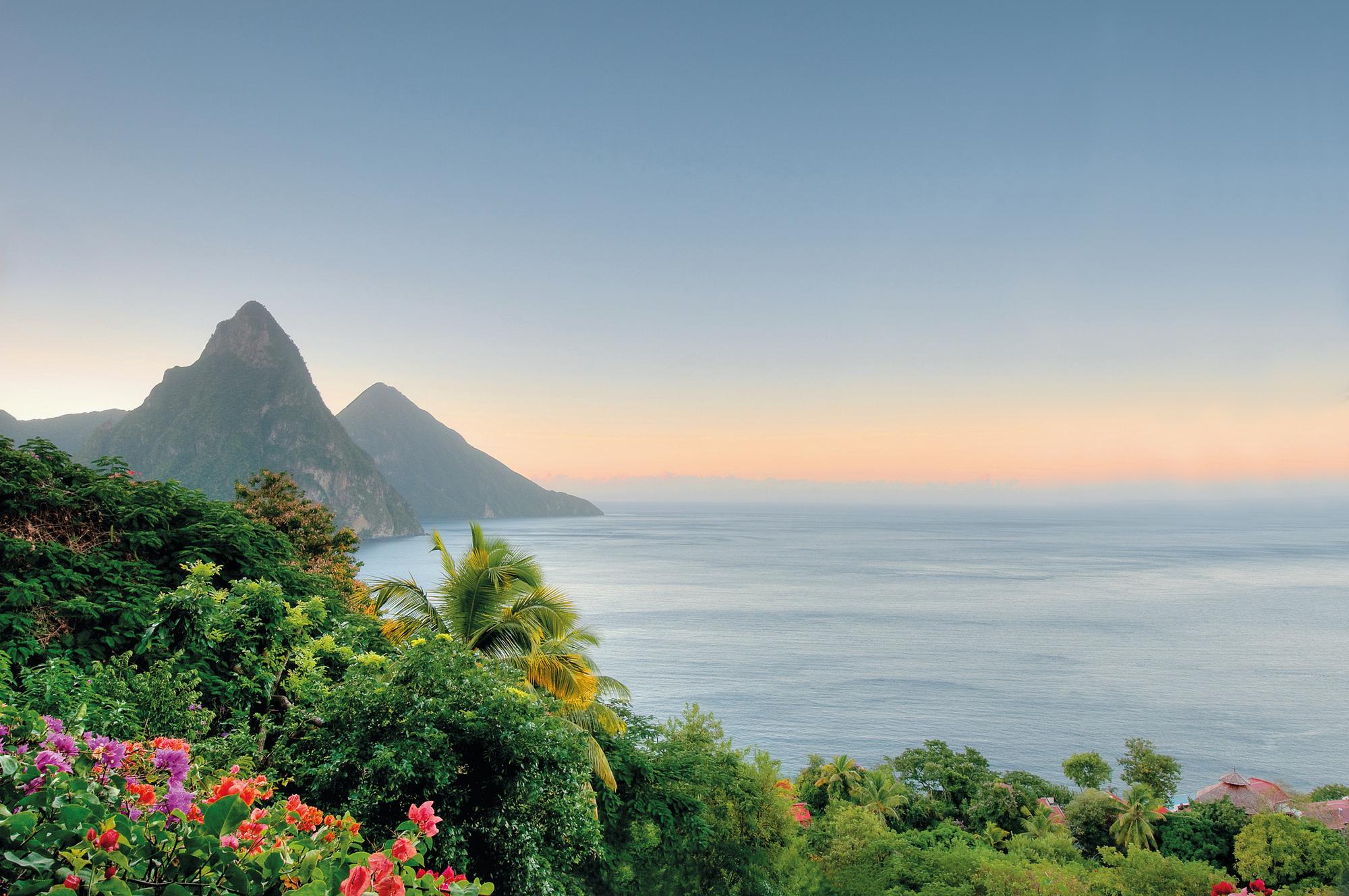 Experience the serene early morning light over the sea in St. Lucia, Caribbean, with Fraser Yachts. | Caribbean, St. Lucia, sea view, early morning light, yacht charter | Fraser