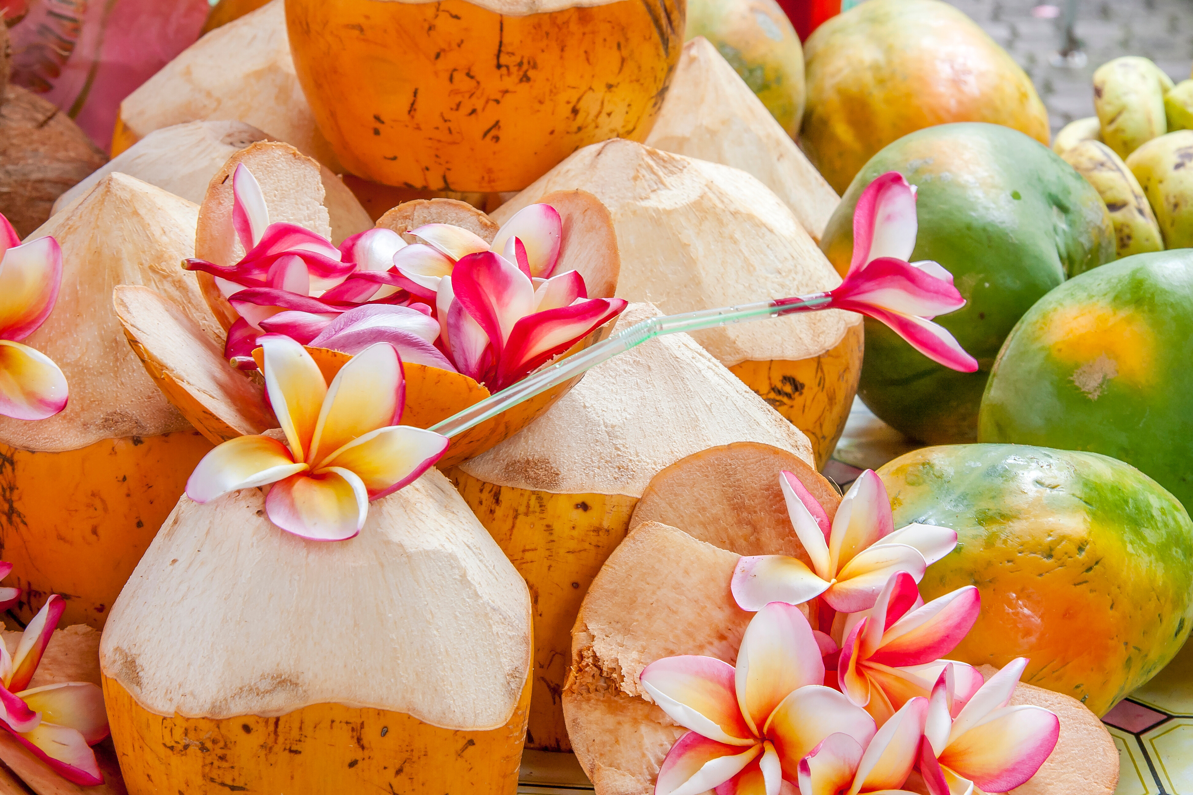 Fresh coconuts and tropical fruits at a vibrant local market in the Seychelles—an authentic island experience showcasing the flavors and culture of the Indian Ocean | Fraser Yachts