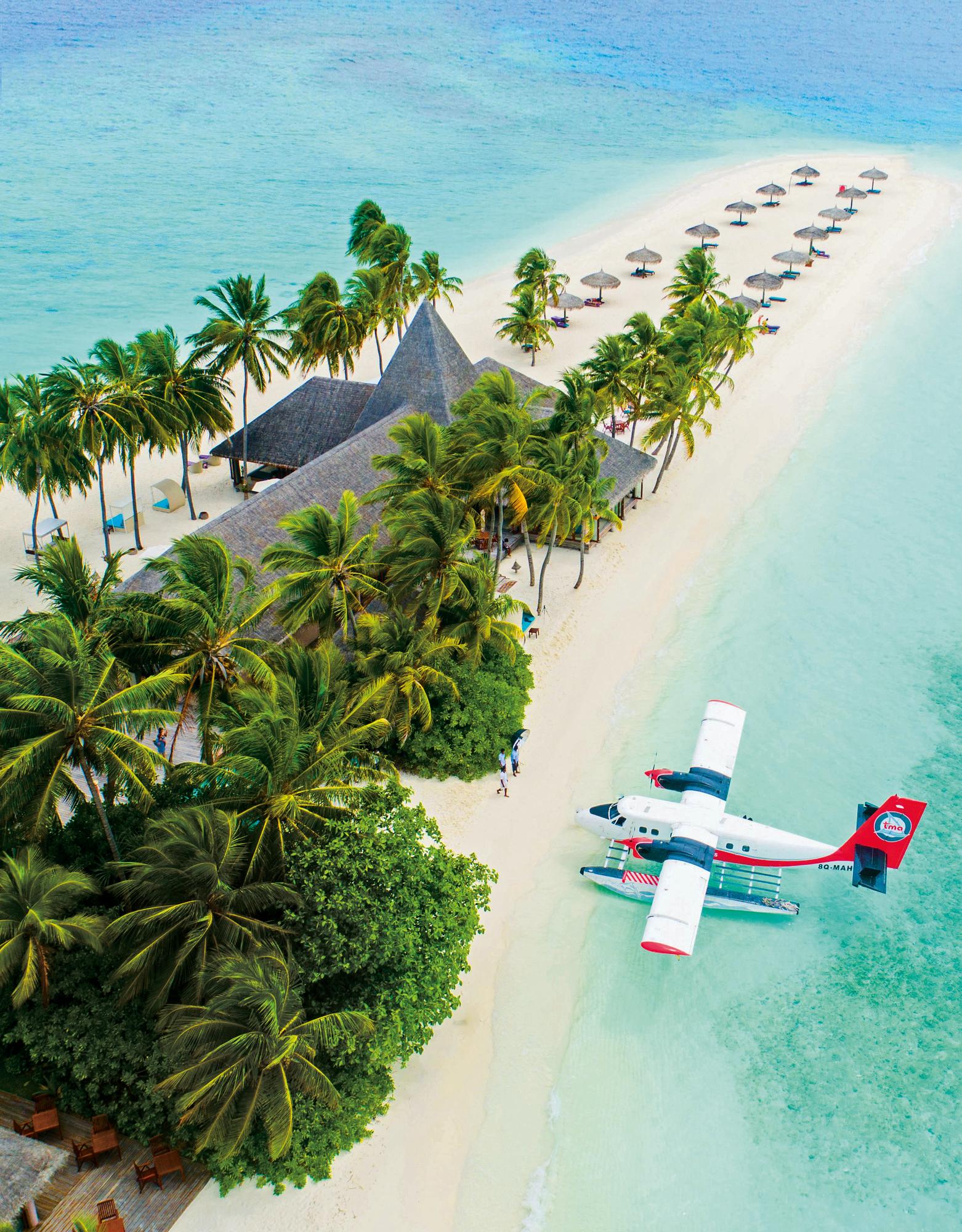 Experience the serene beauty of Veligandu Island in the Maldives with its pristine beaches and flying boats | Indian Ocean, Maldives, Veligandu Island, beach, flying boat | Fraser