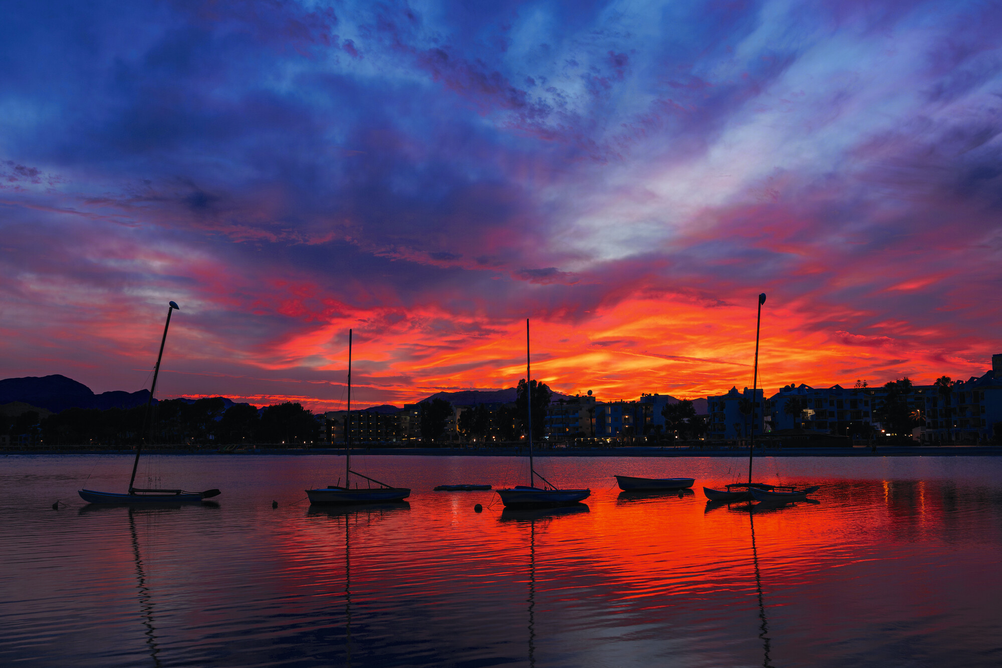 Witness the breathtaking sunset with red and purple hues in the Mediterranean with Fraser Yachts. | Mediterranean, sunset, red and purple lights, yacht charter | Fraser