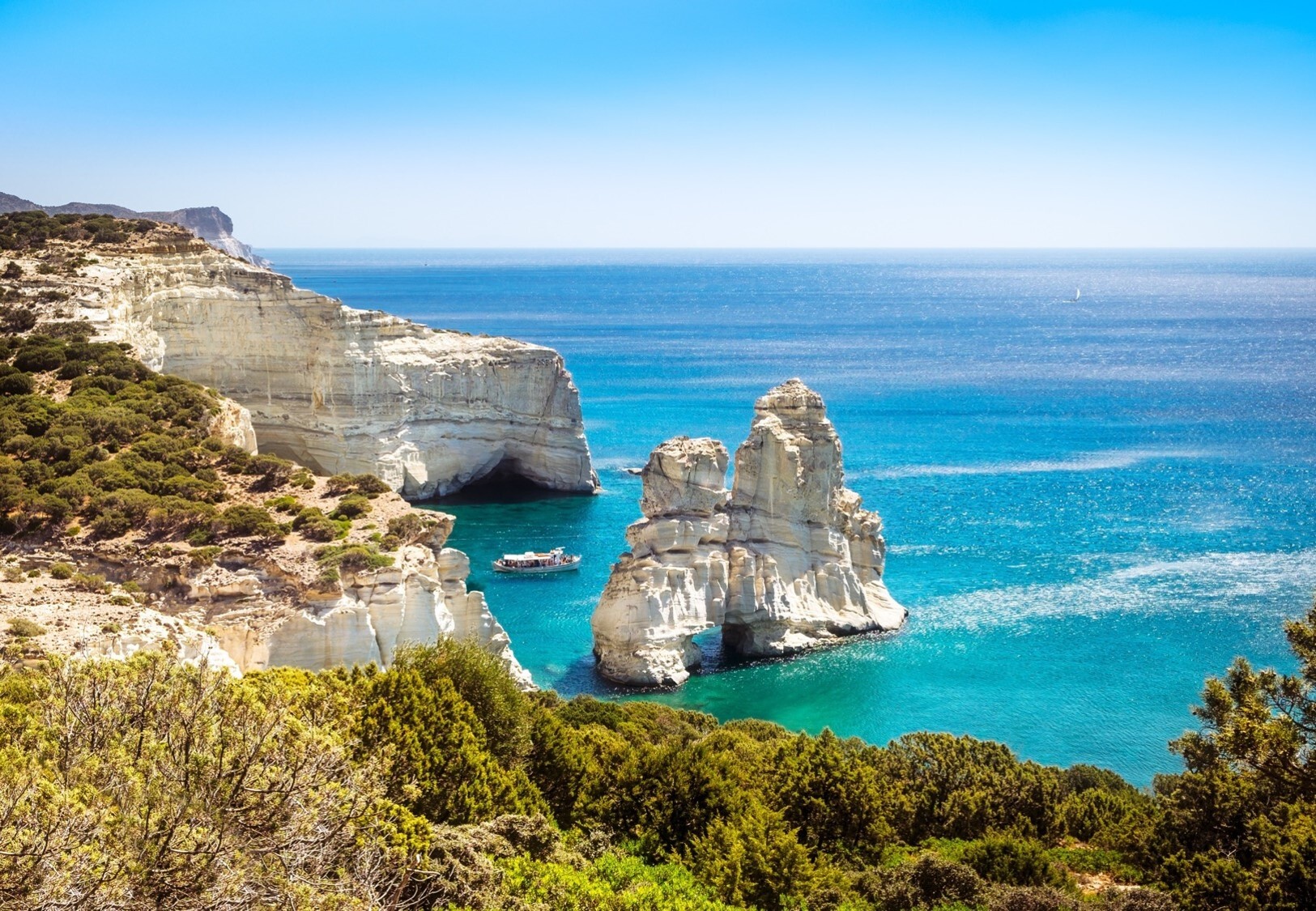Kleftiko cliffs in Milos, Greece—white rock formations and turquoise waters create a stunning Mediterranean seascape, ideal for yacht cruising, swimming, and exploring sea caves | Fraser Yachts