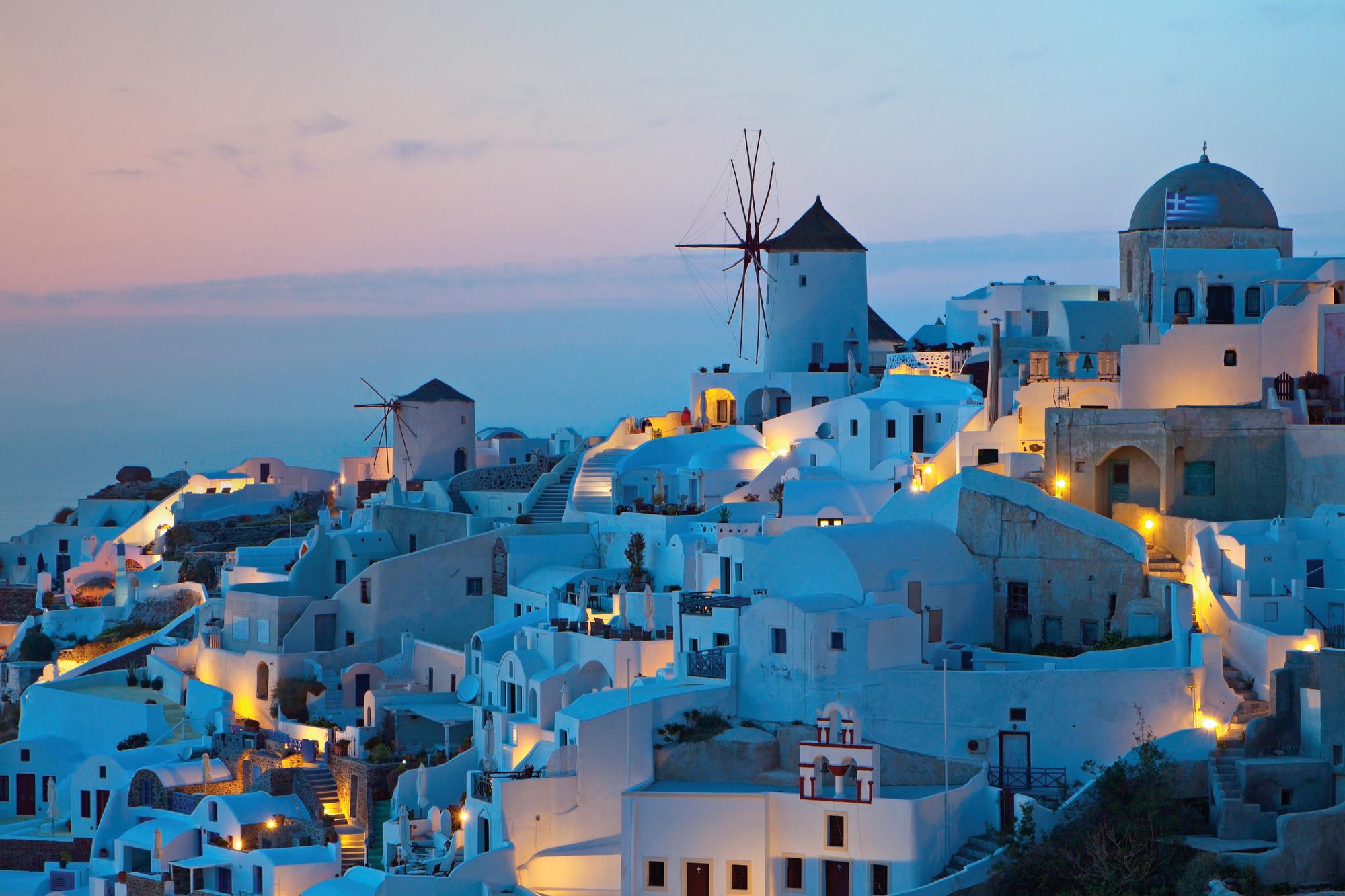 Immerse yourself in the charm of a Santorini village, Greece, a picturesque Mediterranean gem with Fraser Yachts. | Greece, Santorini, village, yacht charter | Fraser