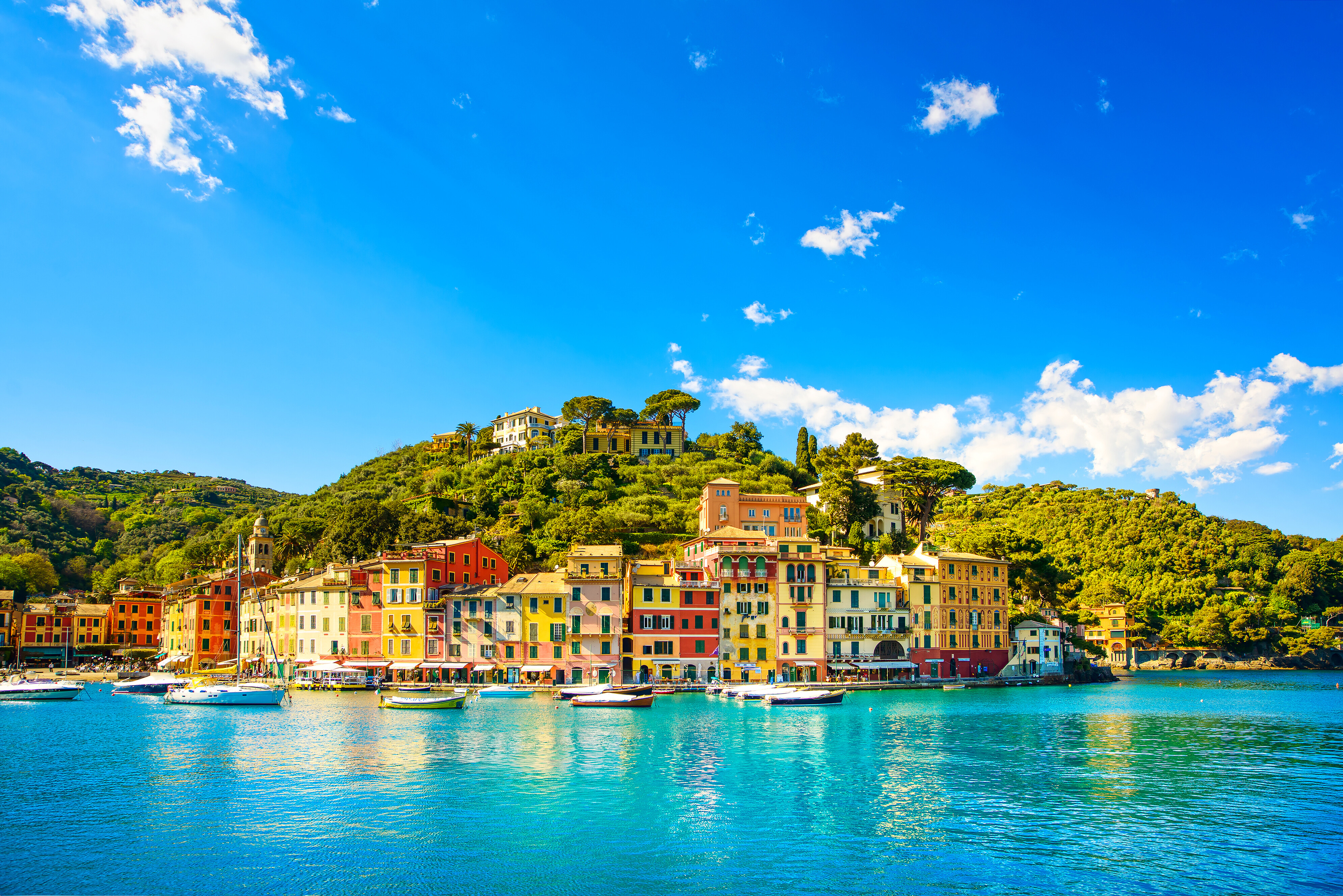 Portofino harbour in Italy—colorful waterfront houses and calm turquoise waters create one of the Mediterranean’s most iconic yachting destinations | Fraser Yachts