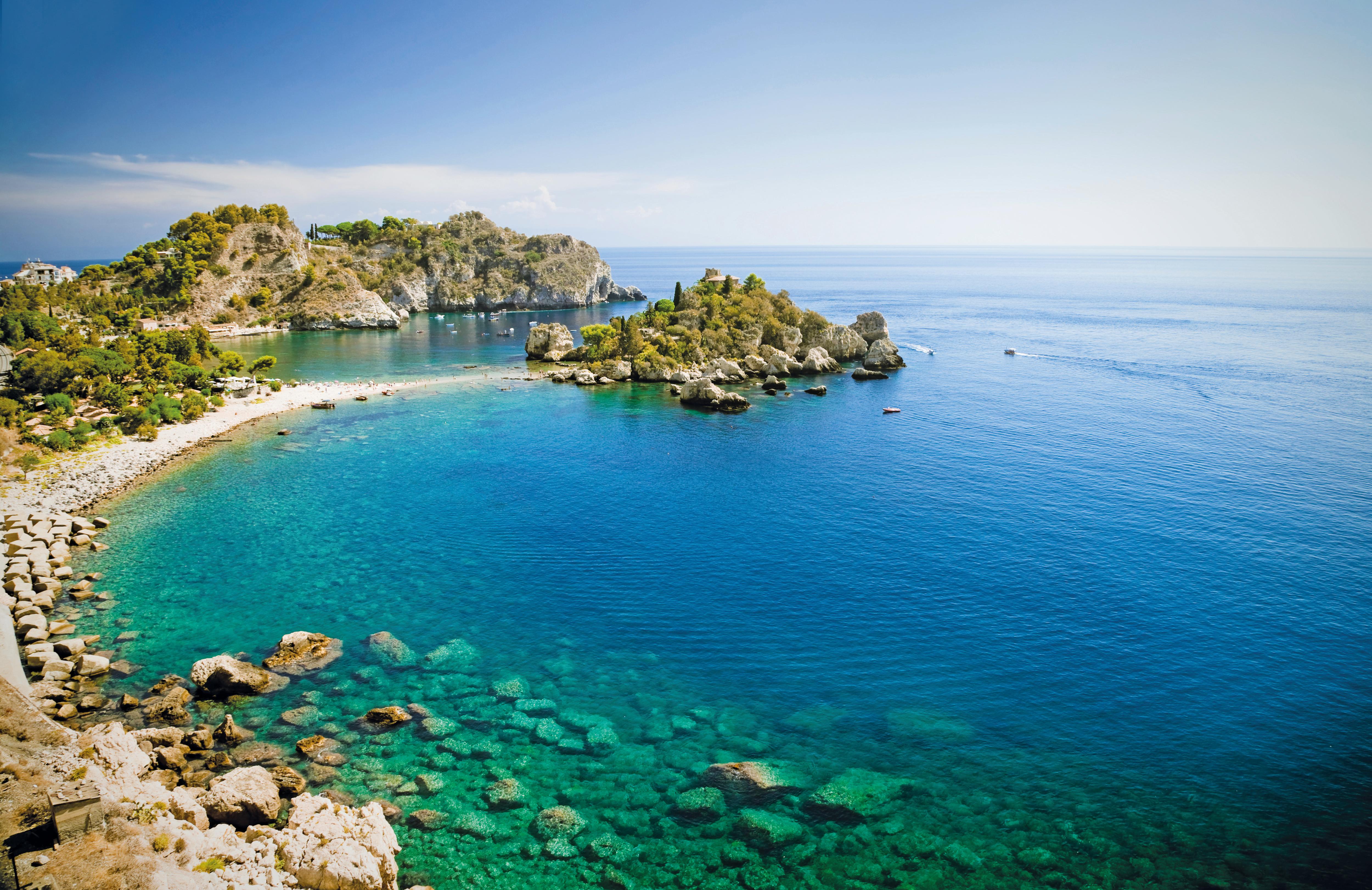 Isola Bella in Taormina, Sicily—crystal-clear waters and rocky coves create a stunning Mediterranean coastline, perfect for yacht anchoring, swimming, and coastal exploration | Fraser Yachts