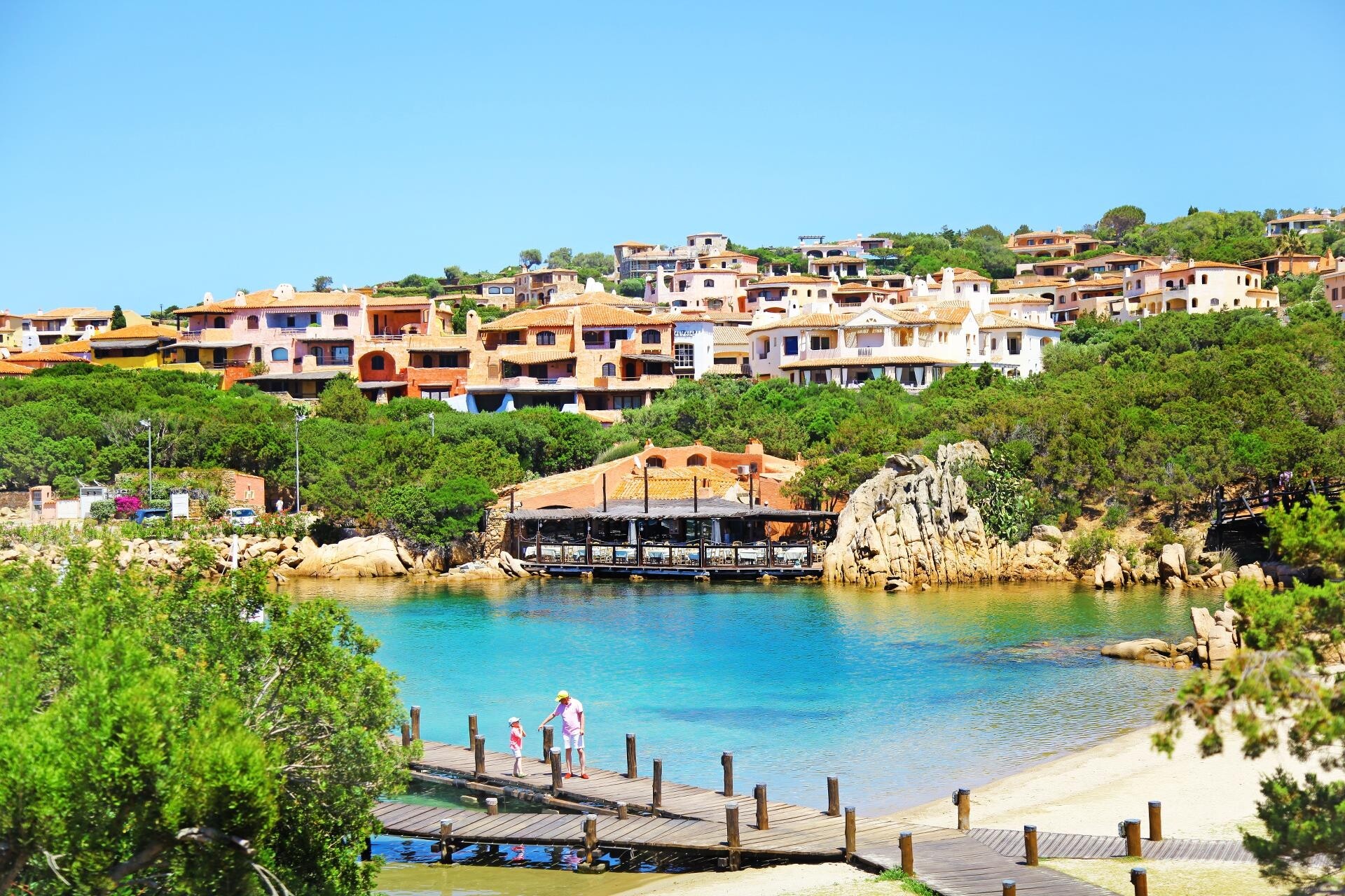 Coastal village in Costa Smeralda, Sardinia—turquoise waters, marina life, and Mediterranean villas create a refined setting for luxury yacht charters | Fraser Yachts