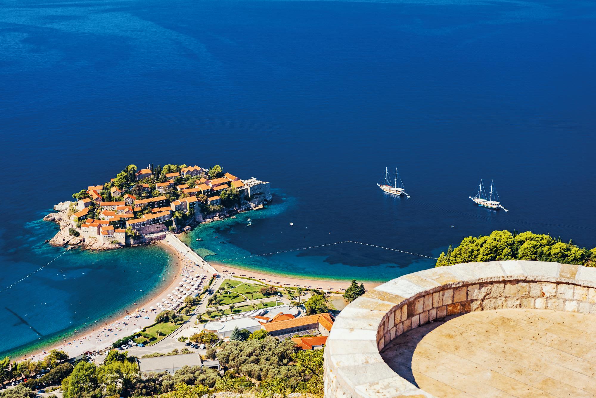 Discover the serene beauty of Sveti Stefan, Montenegro, nestled in the Mediterranean, with Fraser Yachts. | Mediterranean, Montenegro, Sveti Stefan, yacht charter | Fraser