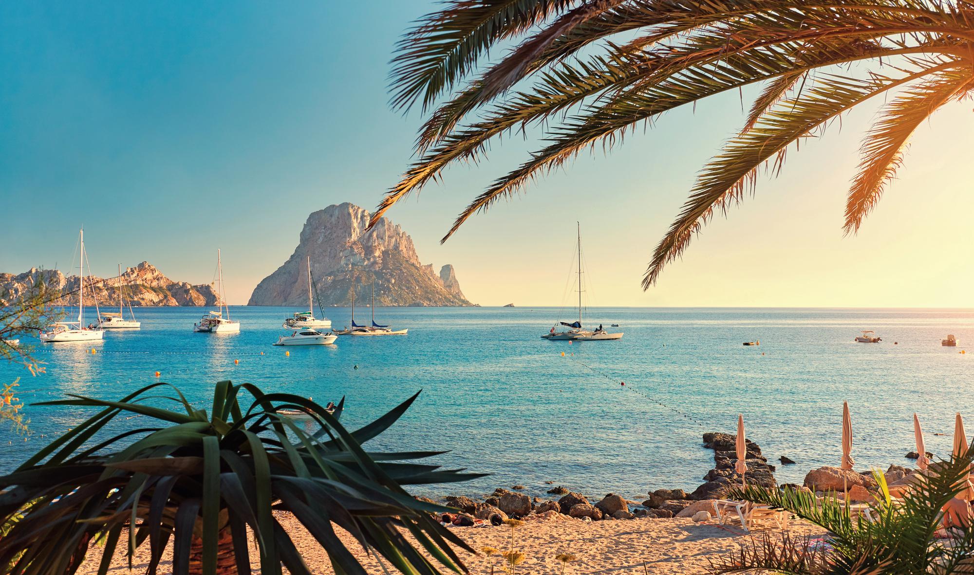 Experience the pristine beauty of Cala d'Hort Beach in the Balearic Islands, Spain, with Fraser Yachts. | Mediterranean, Spain, Balearic Islands, Cala d'Hort Beach, yacht charter | Fraser