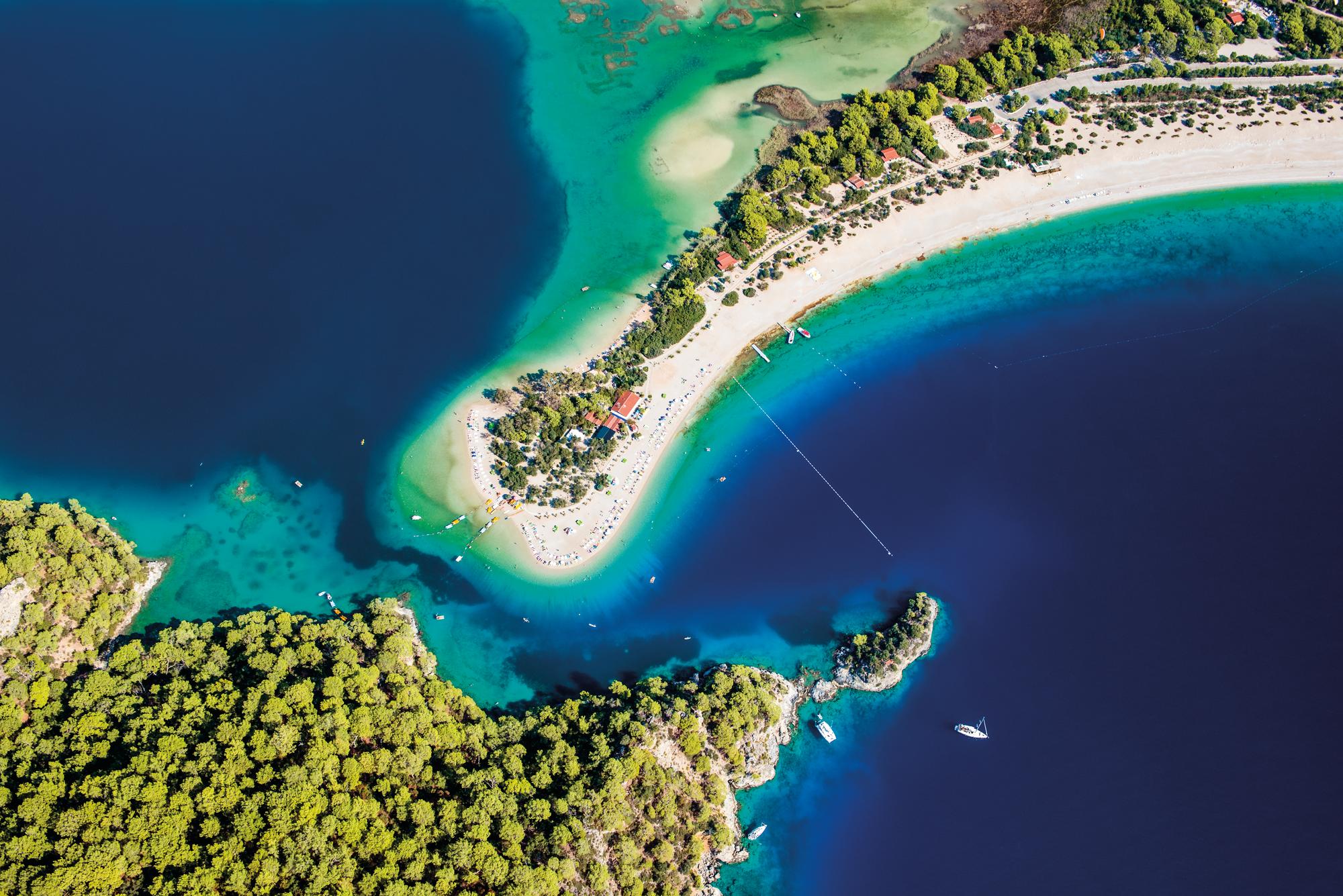 Indulge in the breathtaking aerial view of Oludeniz, Turkey, nestled in the Mediterranean, with Fraser Yachts. | Mediterranean, Turkey, Oludeniz, aerial view, yacht charter | Fraser