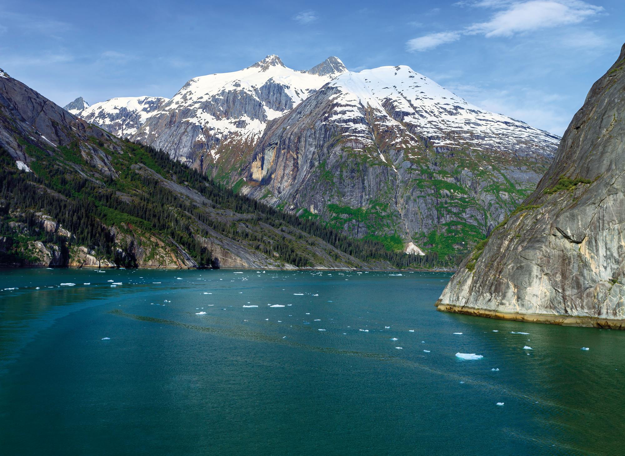 Discover Alaska's majestic mountains, lush forests, and flowing waters | North America, Alaska, mountains, forest, flowing water, snow | FRASER