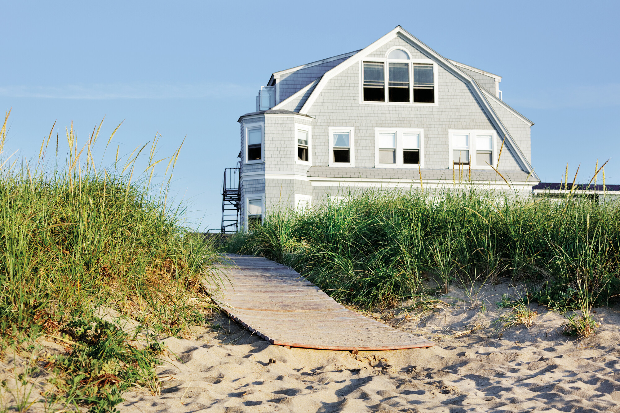 Iconic New England Charm: Discover the quintessential beauty of traditional homes in North America.| New England, North America, typical house | FRASER