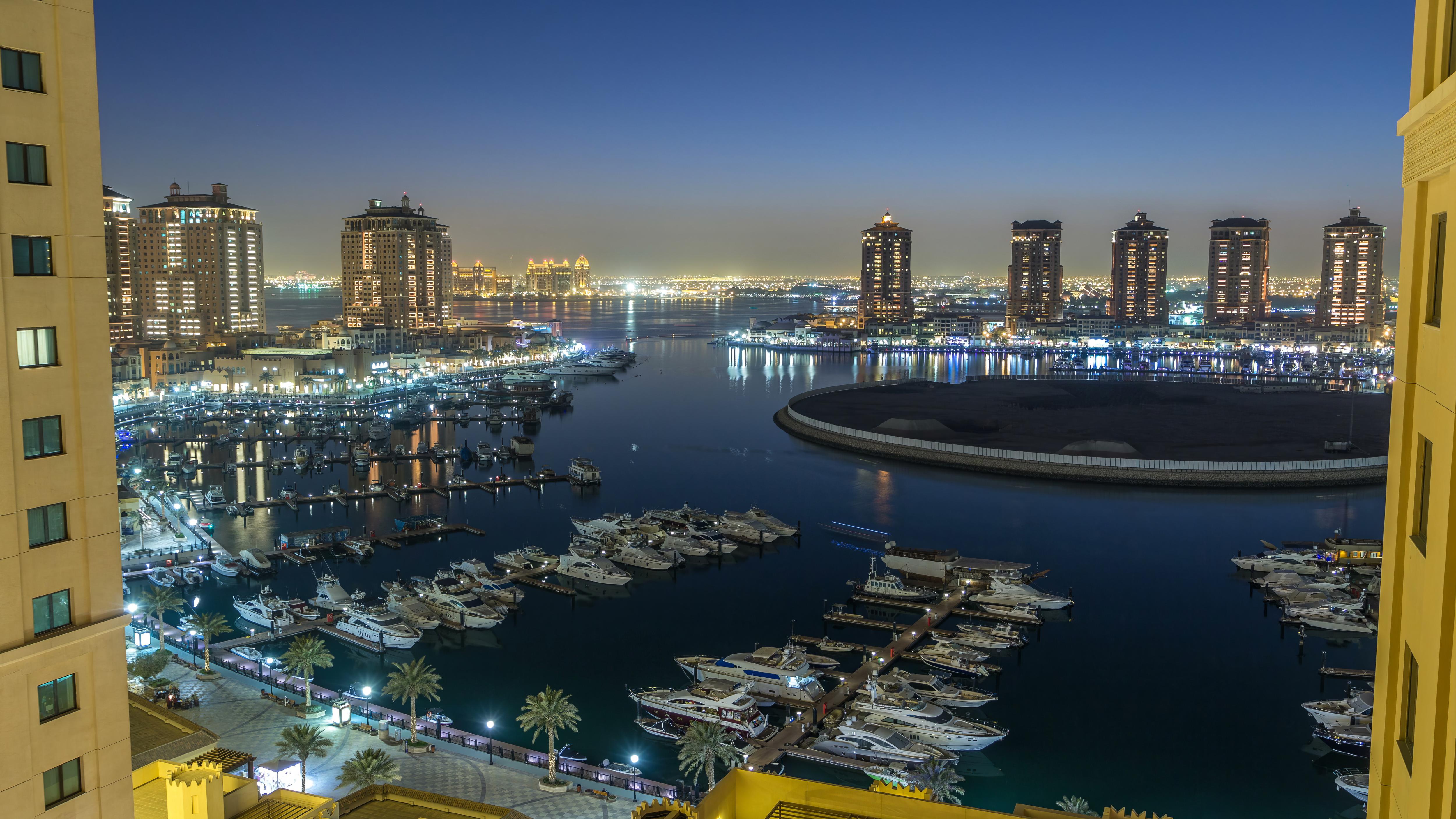 Qatar Boat Show at Old Doha Port—luxury yachts docked in a vibrant marina setting with Doha’s skyline in the background, showcasing the region’s rising profile in global yachting | Fraser Yachts
