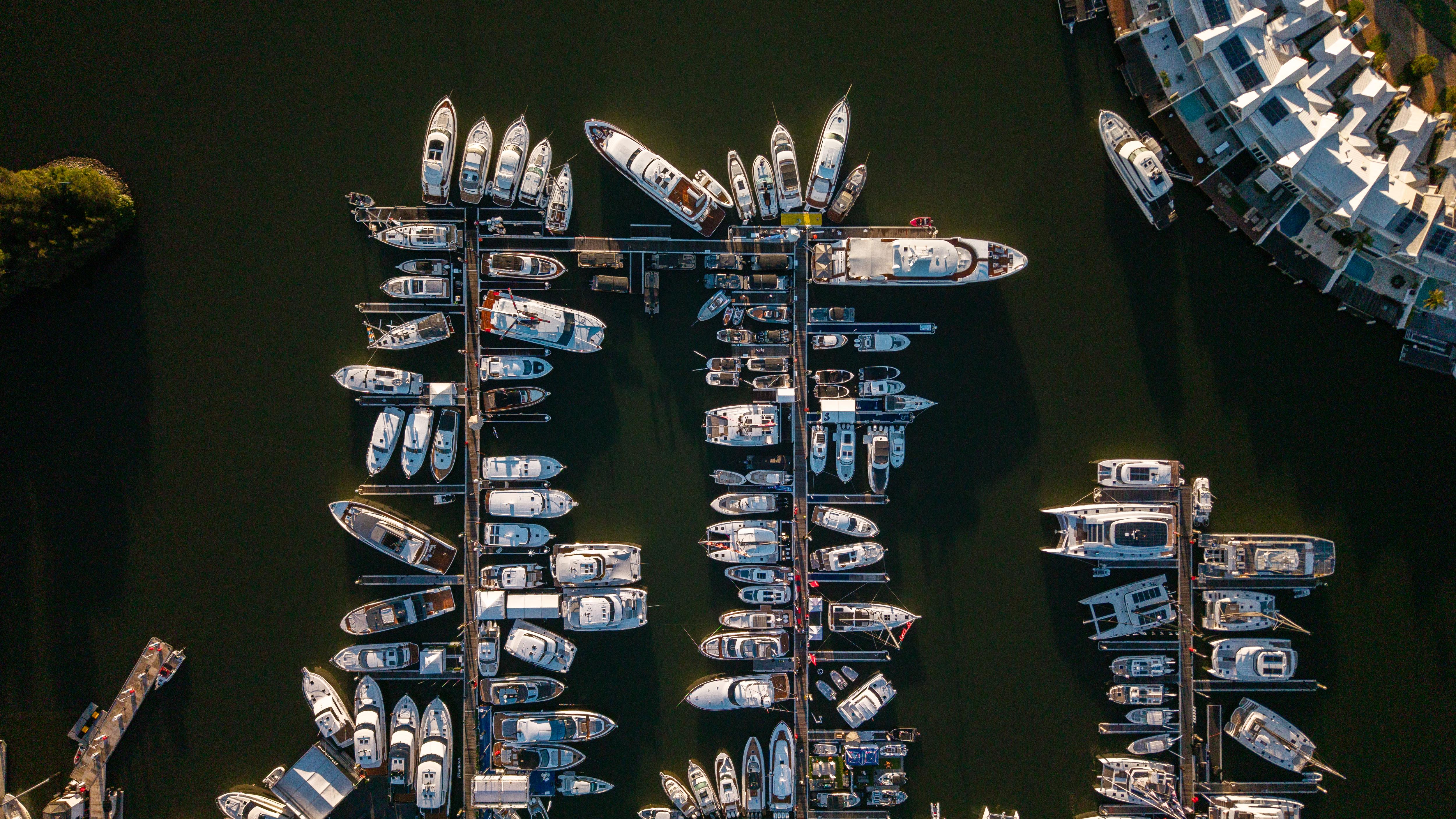 Top view of yachts at Sanctuary Cove Marina, Gold Coast—host of the Sanctuary Cove Boat Show, showcasing luxury vessels in a premium waterfront event setting | Fraser Yachts