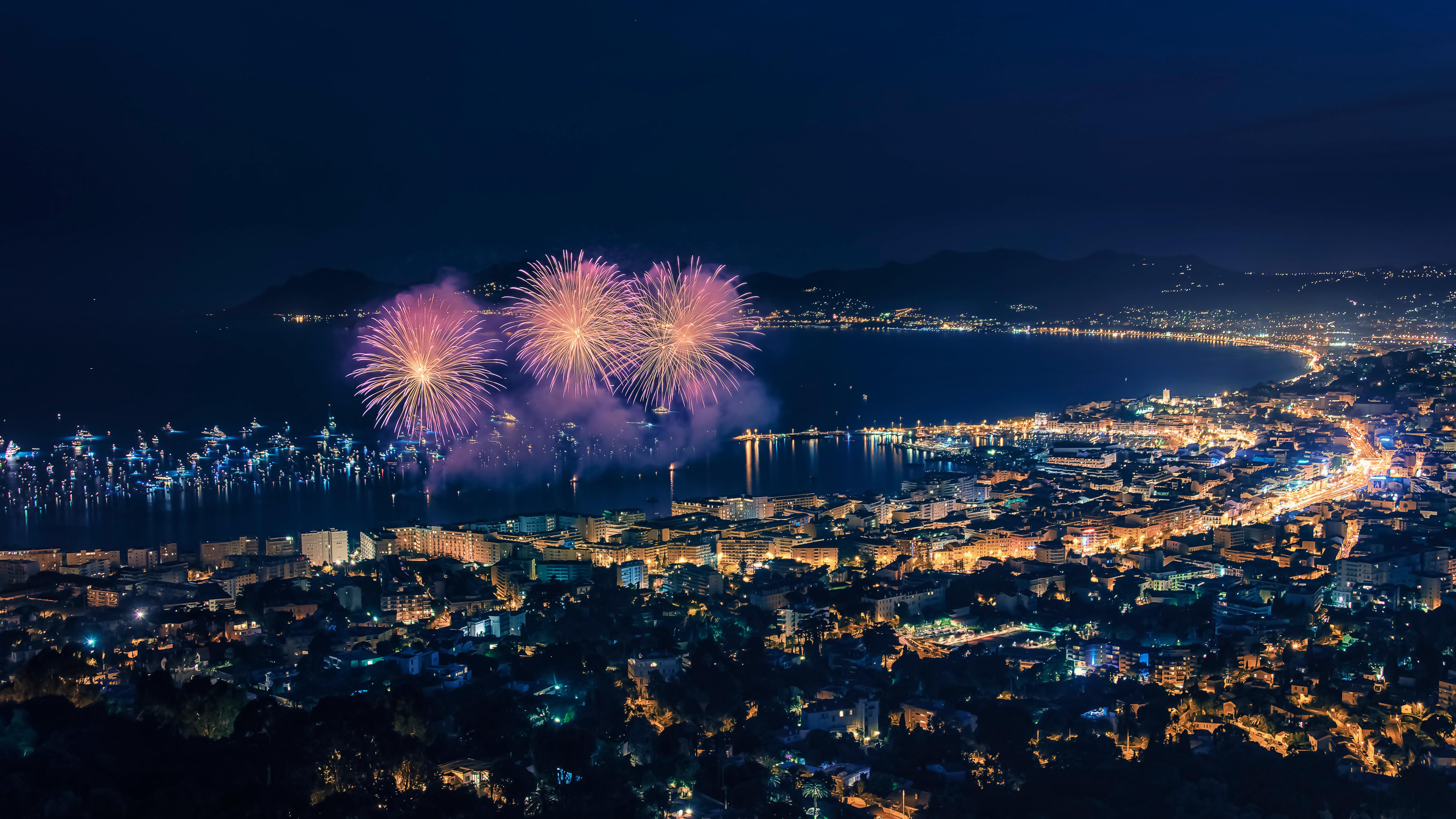 Night view of Cannes during the Film Festival—fireworks light up the bay as superyachts gather along the Croisette, celebrating cinema and Riviera elegance | Fraser Yachts