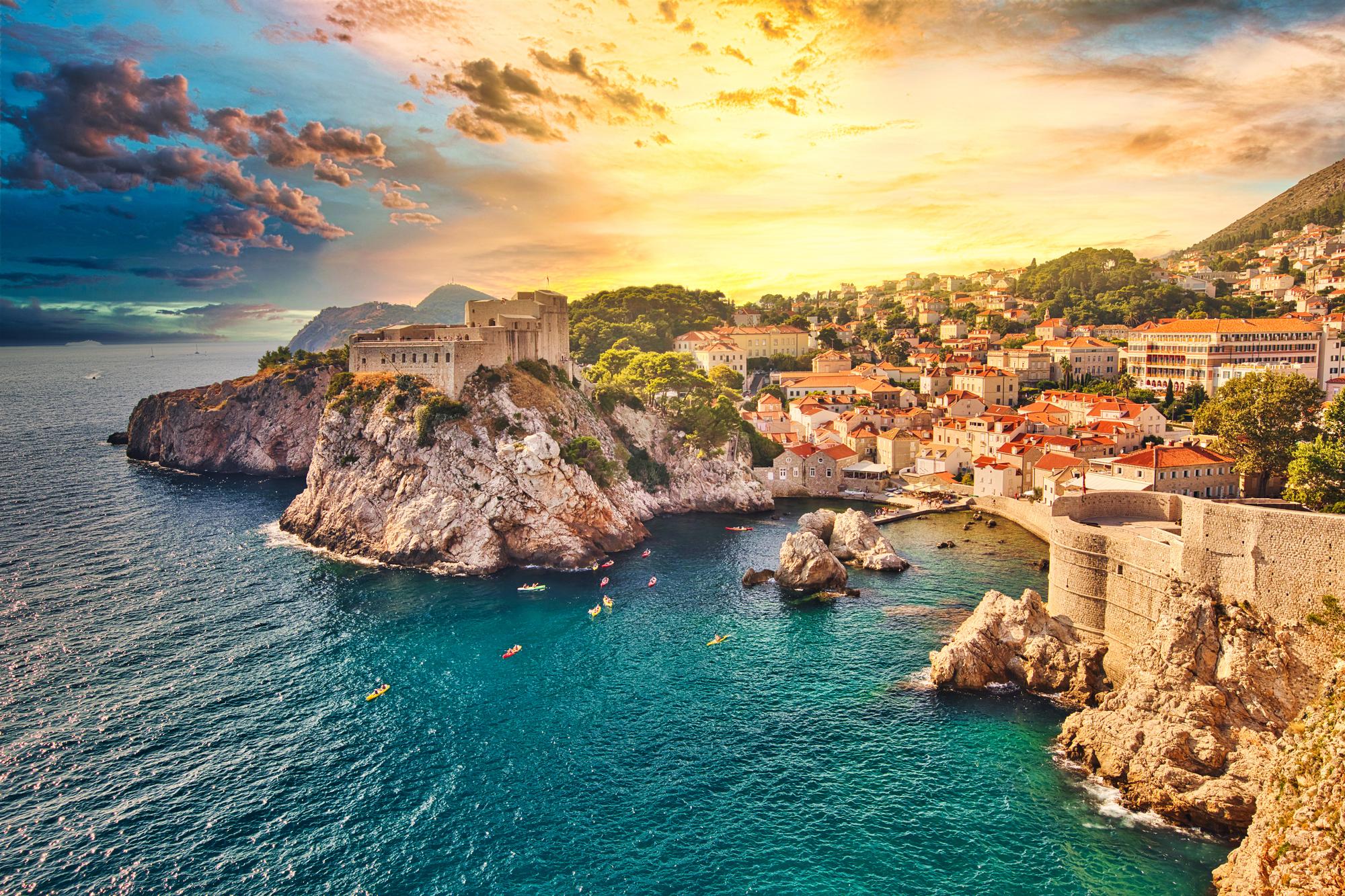 Enjoy an aerial view of Dubrovnik's Walls and Fort Lovrijenac, combining historical sightseeing with impressive city walls | Aerial view, historical, sightseeing, walls, travel, Dubrovnik Walls, Fort Lovrijenac, Croatia | Fraser