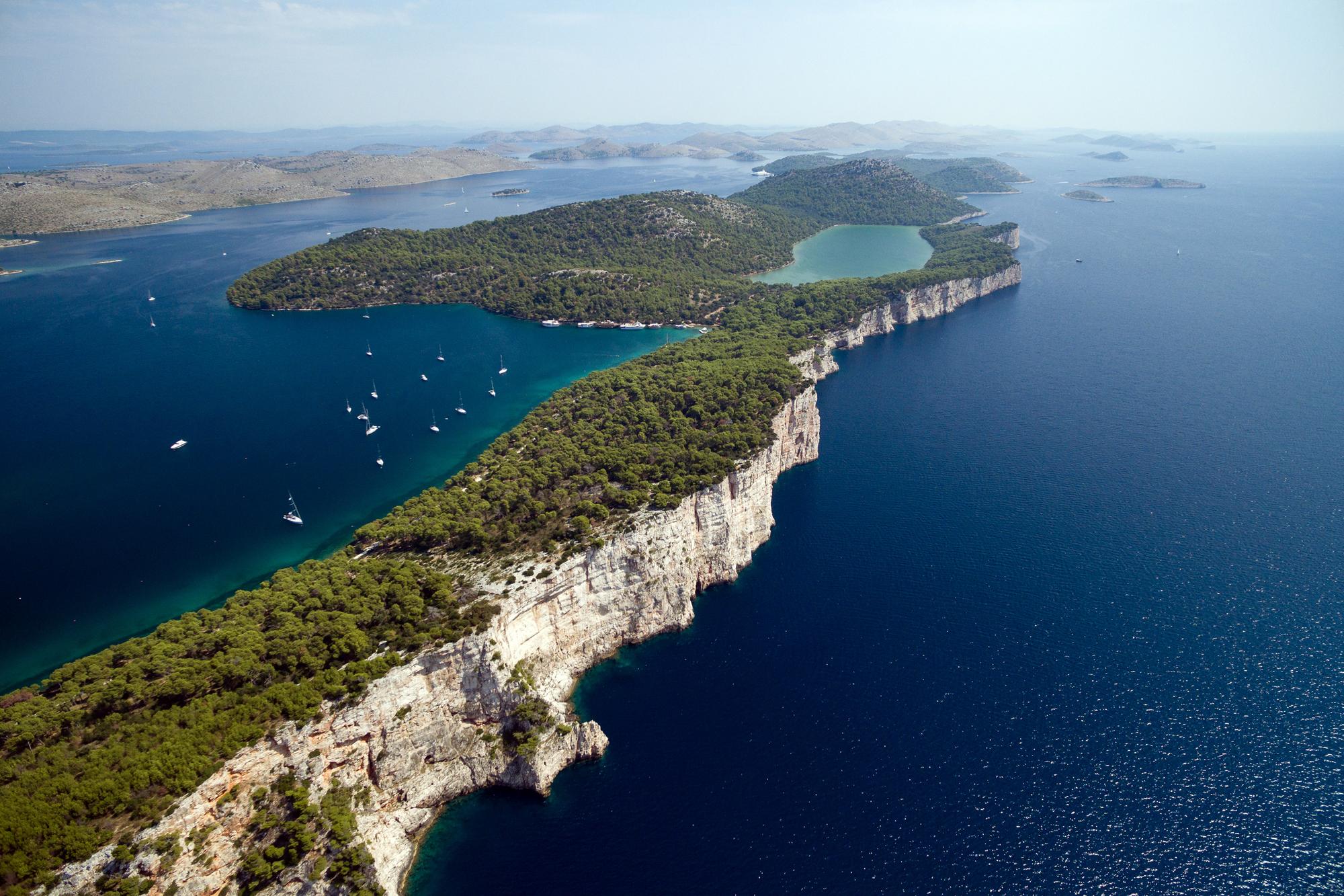 Aerial view of the clear coastal shores of the Kornati Islands in Croatia, showcasing their pristine beauty | Aerial, clear, shore, coastal, Kornati Islands, Croatia | Fraser