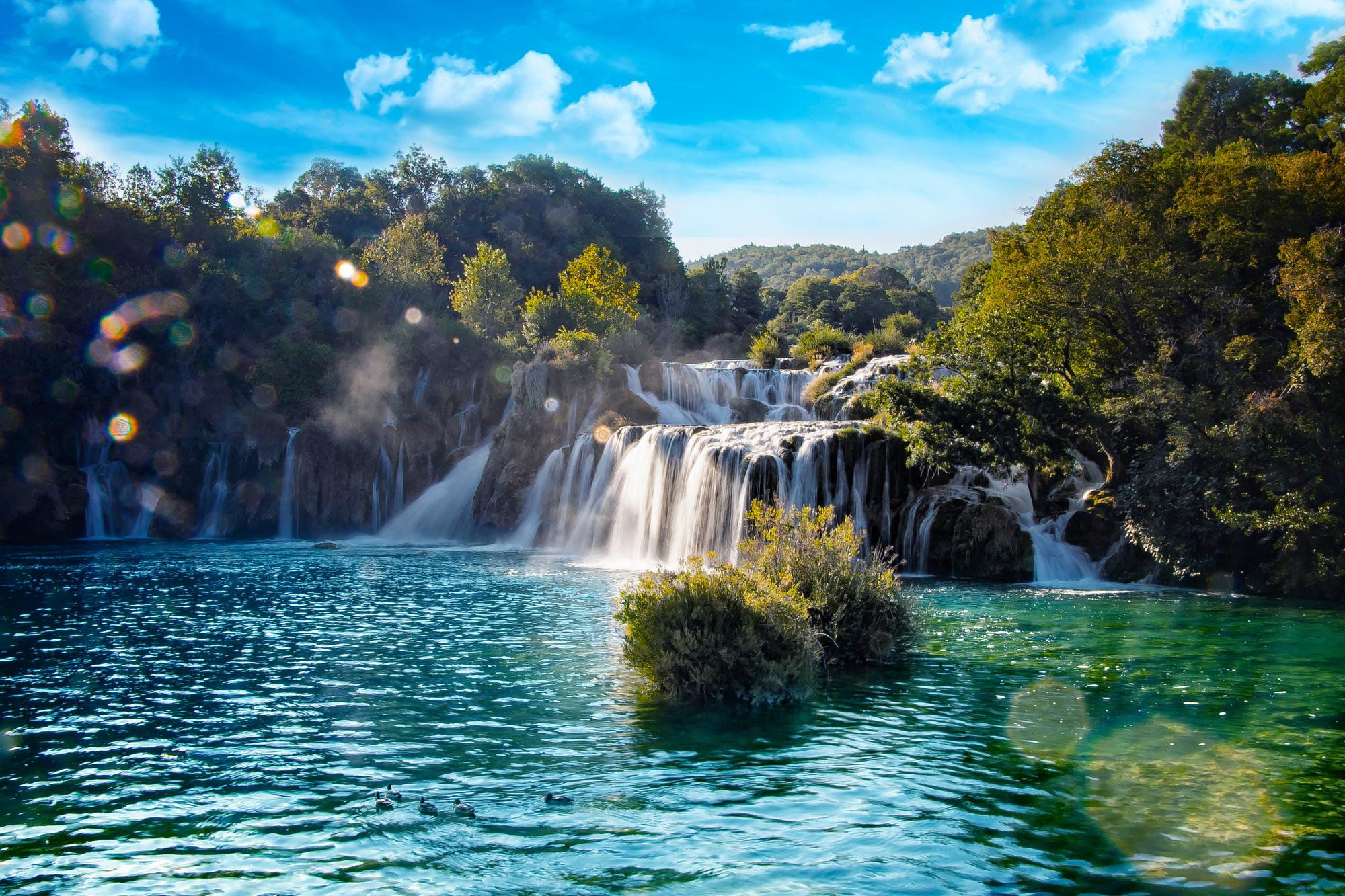 Enjoy the cascading waterfalls, lush forests, and summer vibes in the town of Skradin, Croatia, a national treasure | Cascade, flowing, forest, national, summer, Skradin, Croatia | Fraser