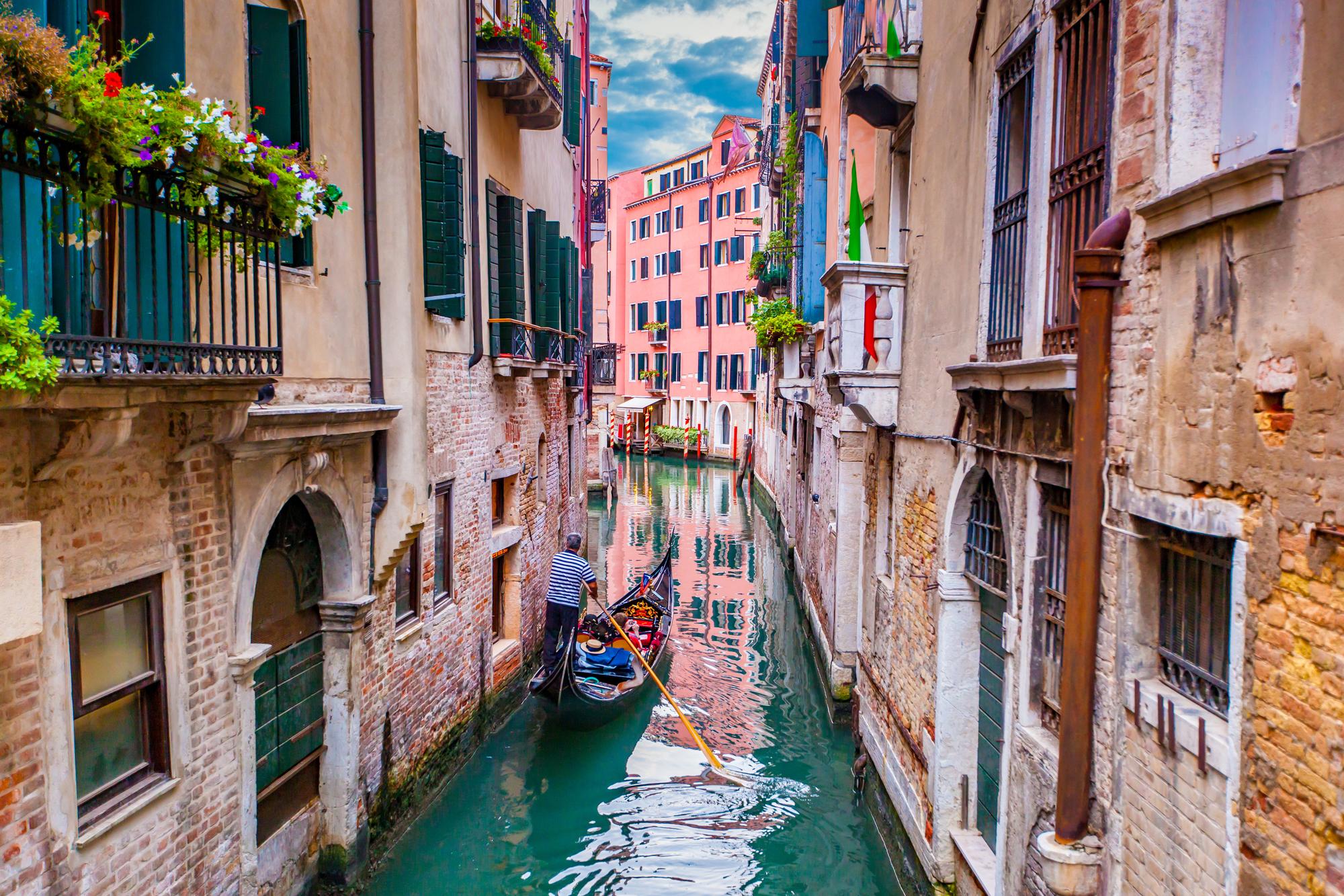 Experience Venice's iconic canals, gondolas, cityscape, and bridges—a must-see for tourism in Italy | Gondola, tourism, cityscape, bridge, Venice, Italy | Fraser