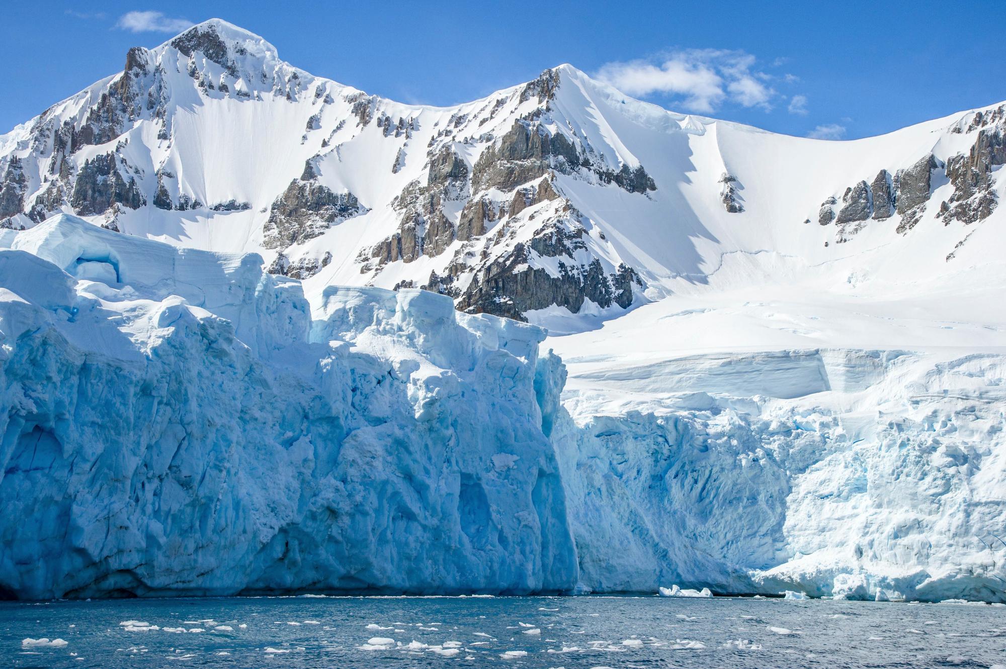 Marvel at the natural beauty of Antarctica's glacier cliffs, a true tourism highlight | Cliff, natural beauty, tourism | Fraser