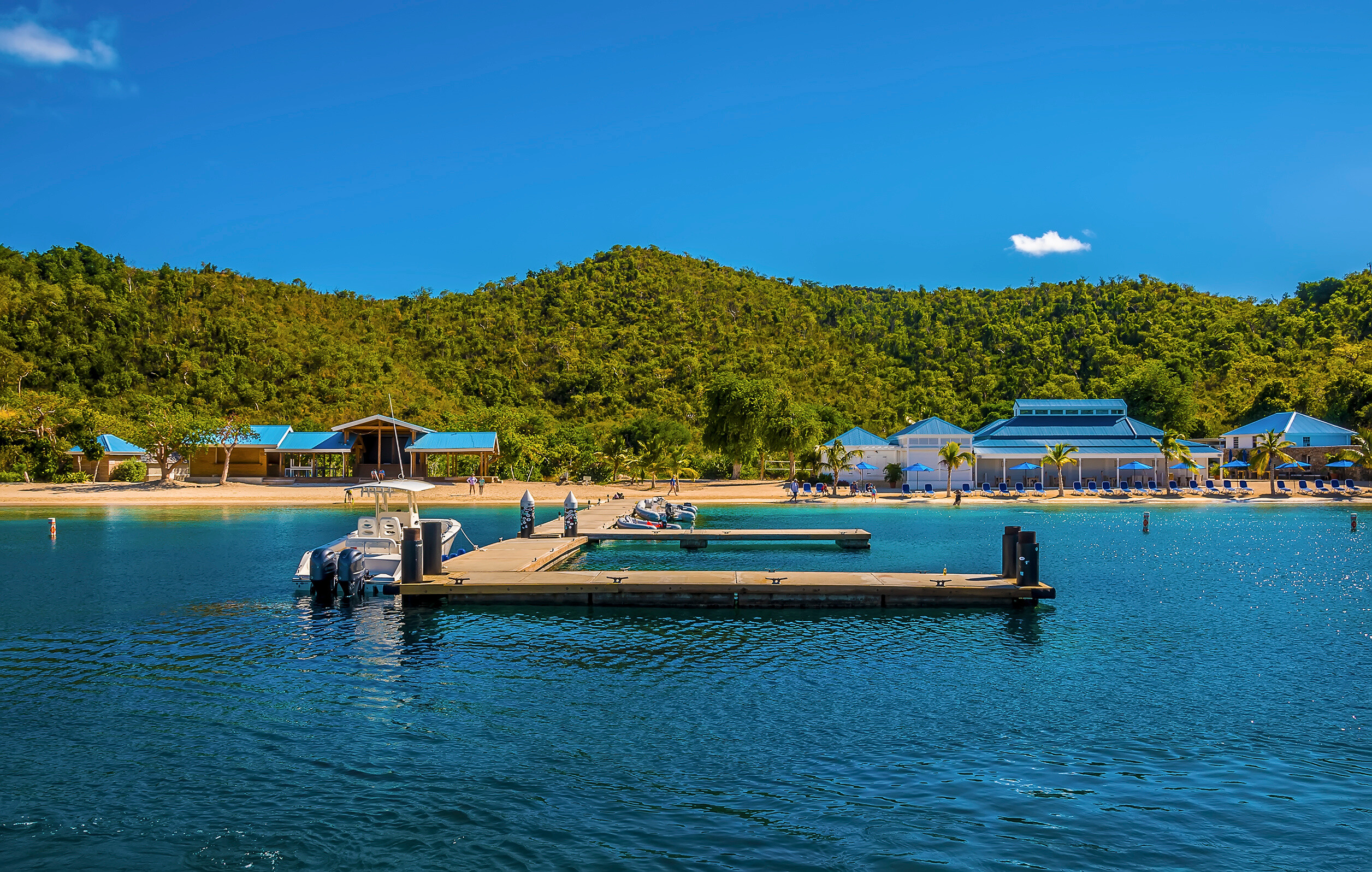 View across Landing Bay at Norman Island, BVI—calm turquoise waters, tropical hills, and peaceful harbors ideal for morning anchorage, tender landings, and leisure yacht cruising | Fraser Yachts