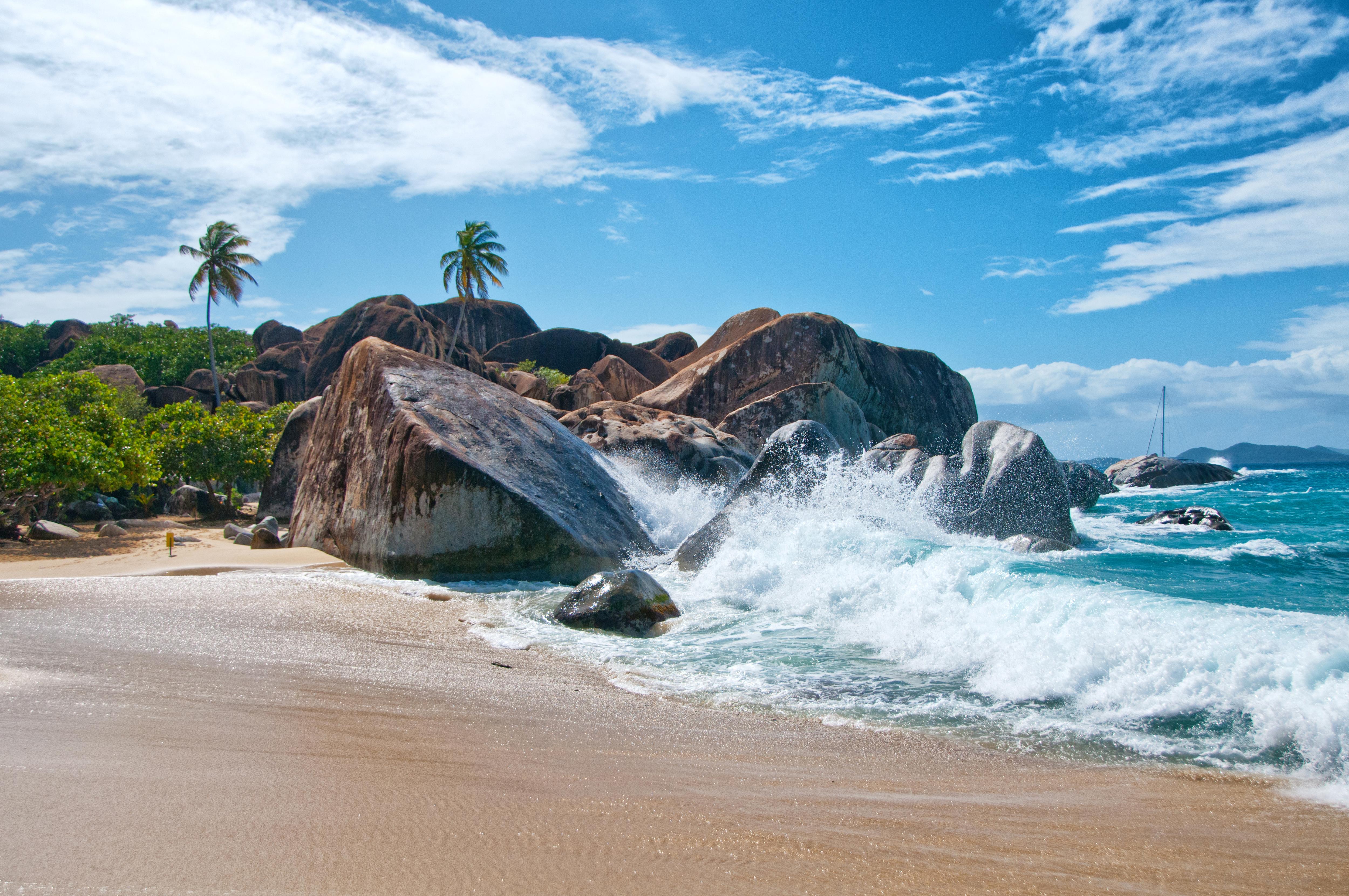 Splashing waves and granite boulders at The Baths, Virgin Gorda—an iconic BVI destination with turquoise lagoons, hidden coves, and dramatic rock formations perfect for exploration | Fraser Yachts