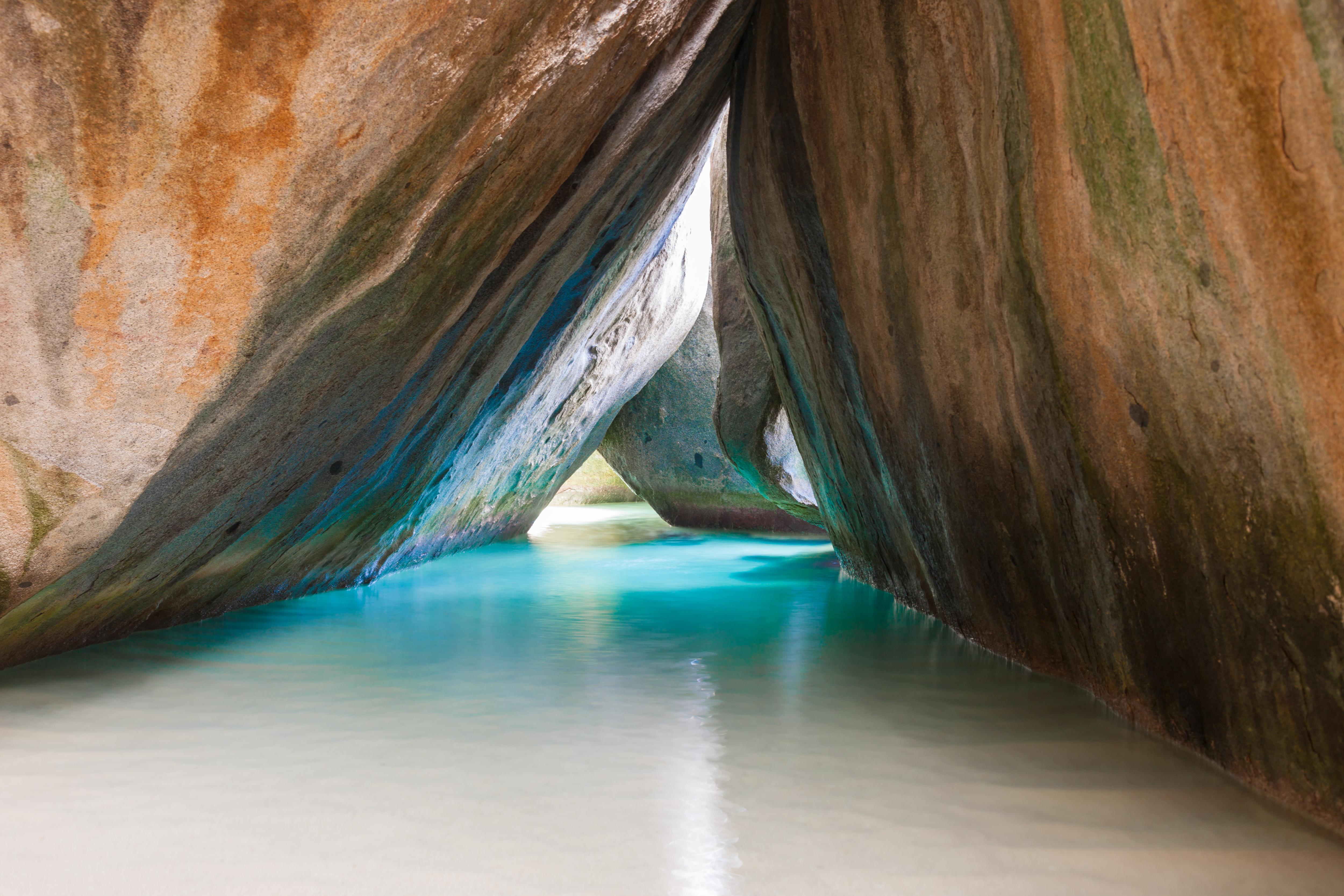 The Baths on Virgin Gorda, BVI—giant granite boulders, turquoise pools, and soft sand make this world-famous beach a must-visit stop on any luxury Caribbean yacht charter | Fraser Yachts