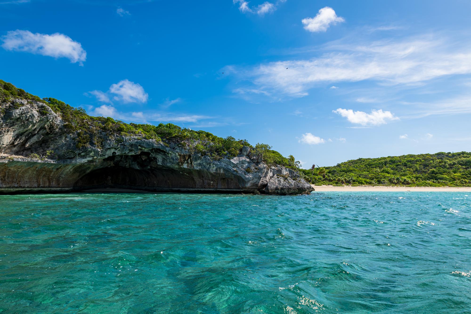 Explore the colorful coast and paradise caves of Exumas, Bahamas, adorned with vibrant plant life and crashing waves | Coast, colorful, paradise, plant, trip, wave, Exumas, Bahamas | Fraser