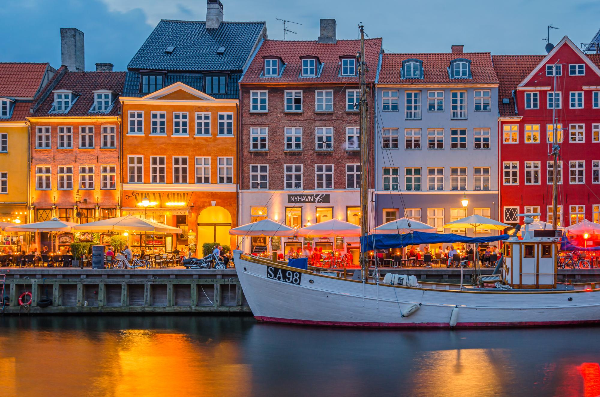 Discover the picturesque architecture and illuminated buildings of Copenhagen from a charming boat tour | Architecture, Boat, Picturesque, Copenhagen, Tourist | Fraser