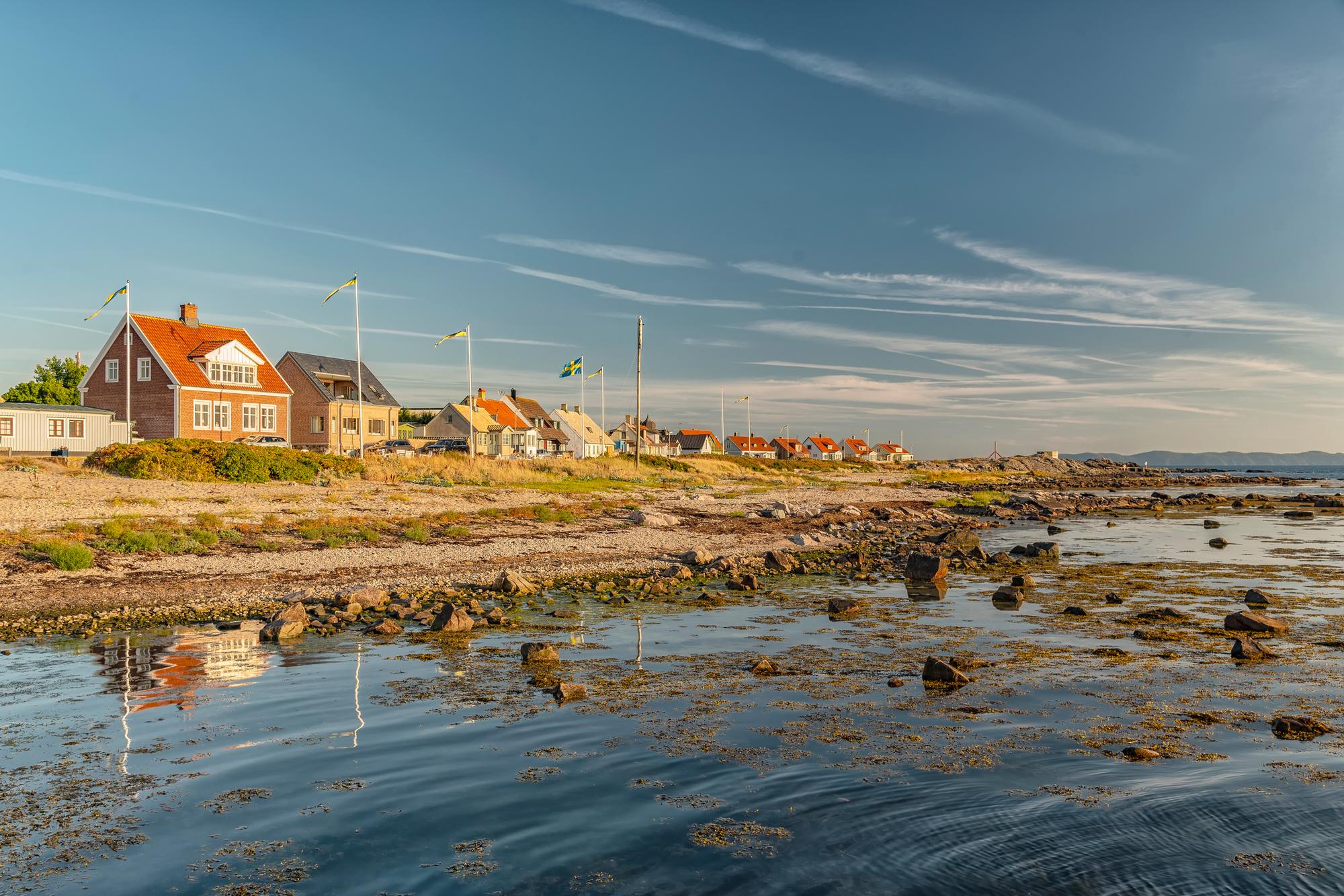 Enjoy a relaxing day at Torekov's pebble beach, set along the stunning coastline of Sweden with tranquil views | Coastline, Pebble, Beach, Sweden | Fraser