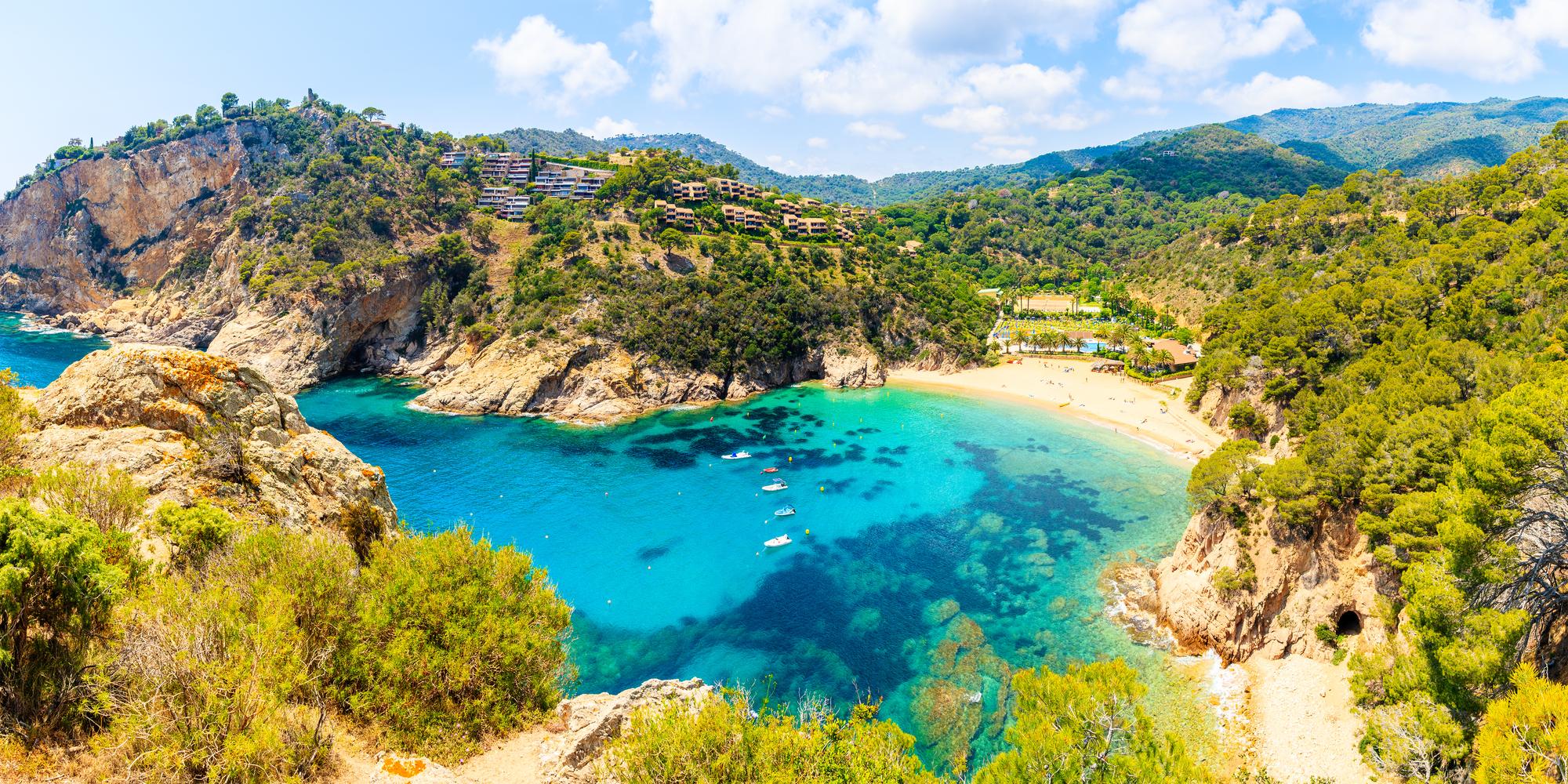 Explore the stunning Costa Brava in Catalonia, featuring picturesque bays, beautiful beaches, azure waters, natural landscapes, sailboats, and vibrant summer vibes | Bay, beach, blue, nature, sailboat, summer, Costa Brava, Catalonia | Fraser