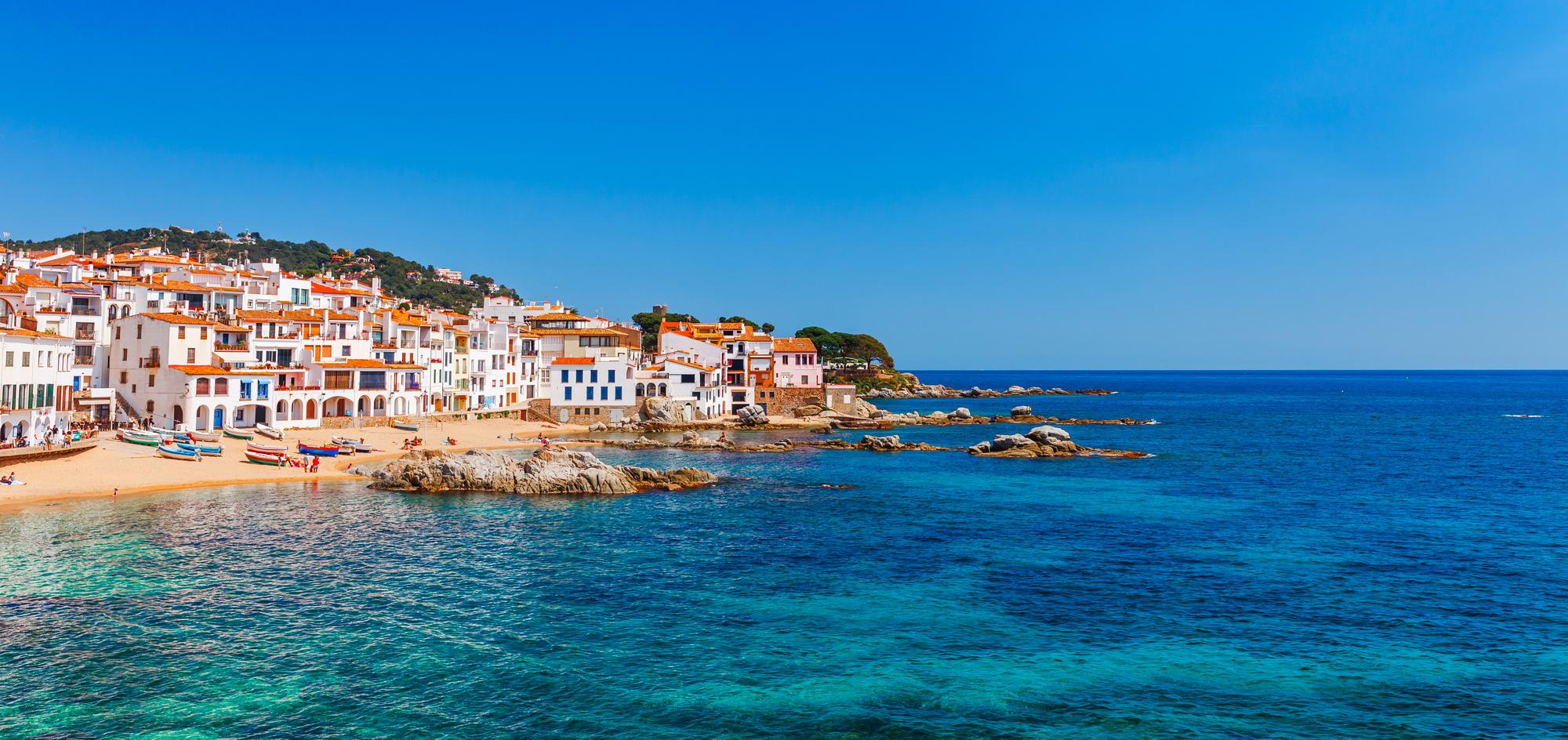 Explore the picturesque Calella de Palafrugell in Catalonia, Spain, known for its charming architecture, historic old town, ideal for vacation travel, and turquoise waters | Architecture, old town, vacation, travel, turquoise | Fraser