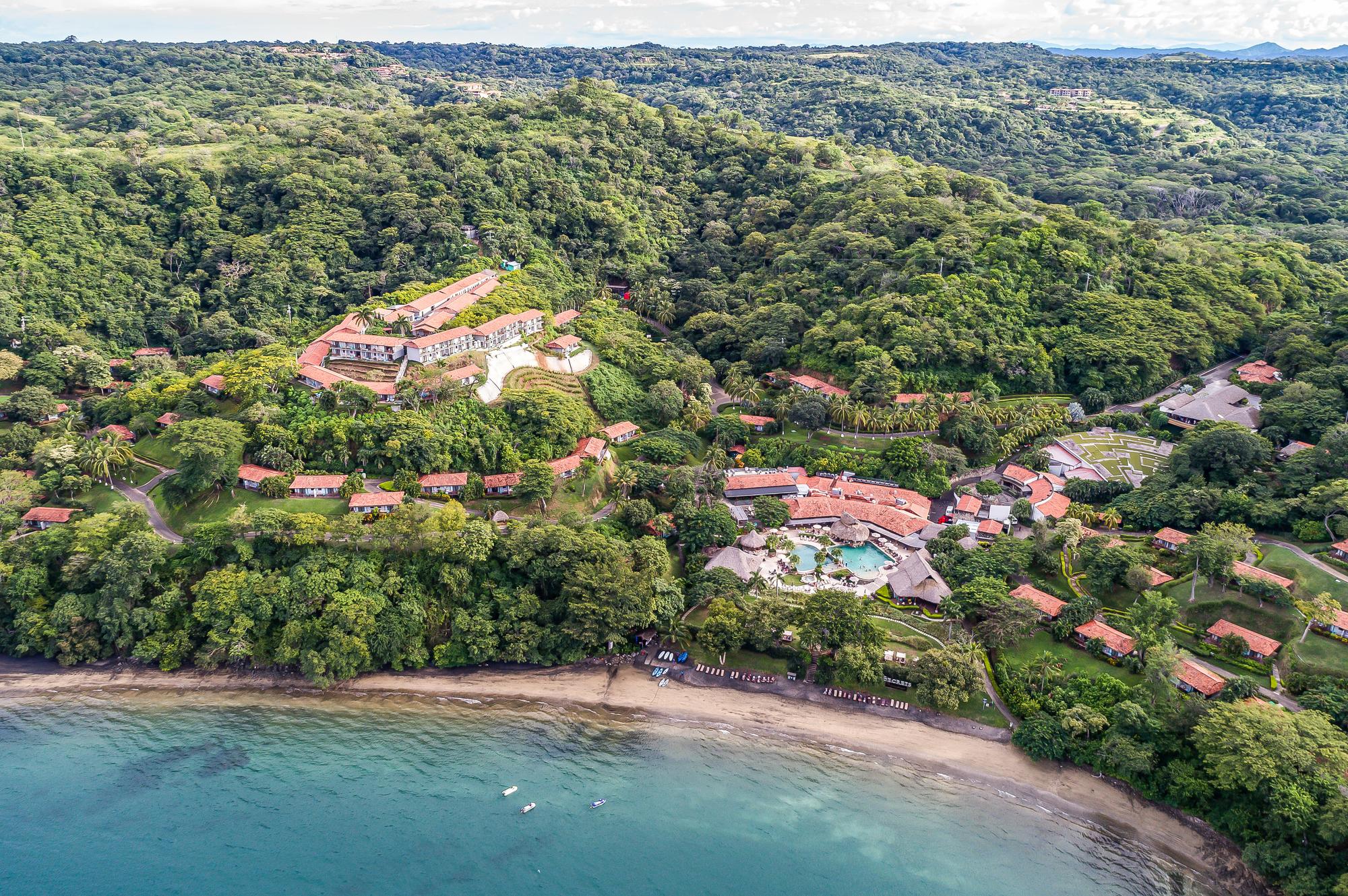 Experience the luxury of Papagayo Resort with an aerial view of its stunning tropical landscape, golf course, and relaxing amenities | Hotel, Aerial, Luxury, Resort, Tropical, Golf, Relax | Fraser