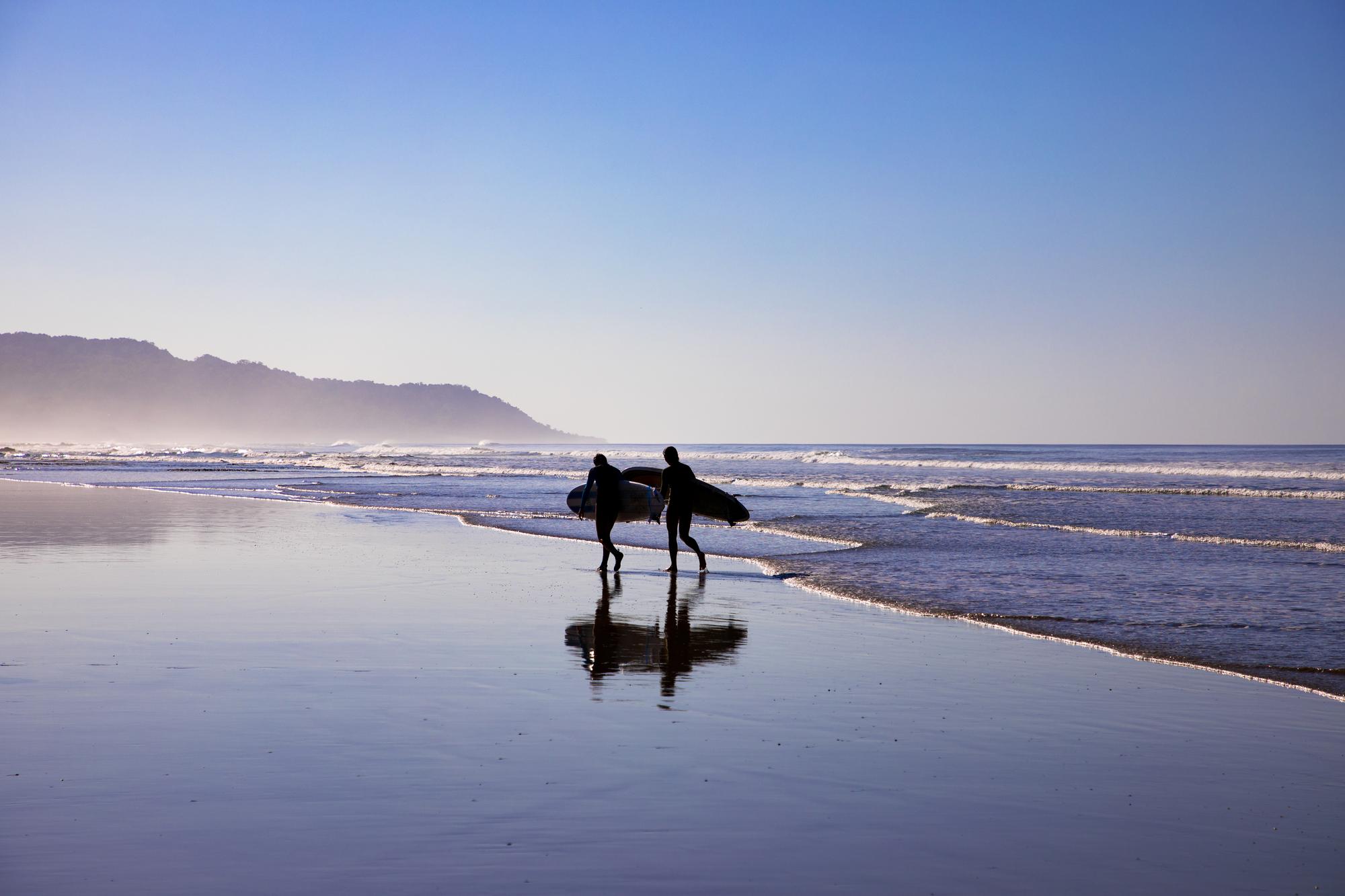 Catch the perfect wave at Costa Rica’s beautiful beach at sunrise with vibrant silhouettes and moments of surfing bliss | Beach, Surfing, Sunrise, Sand, Silhouette | Fraser