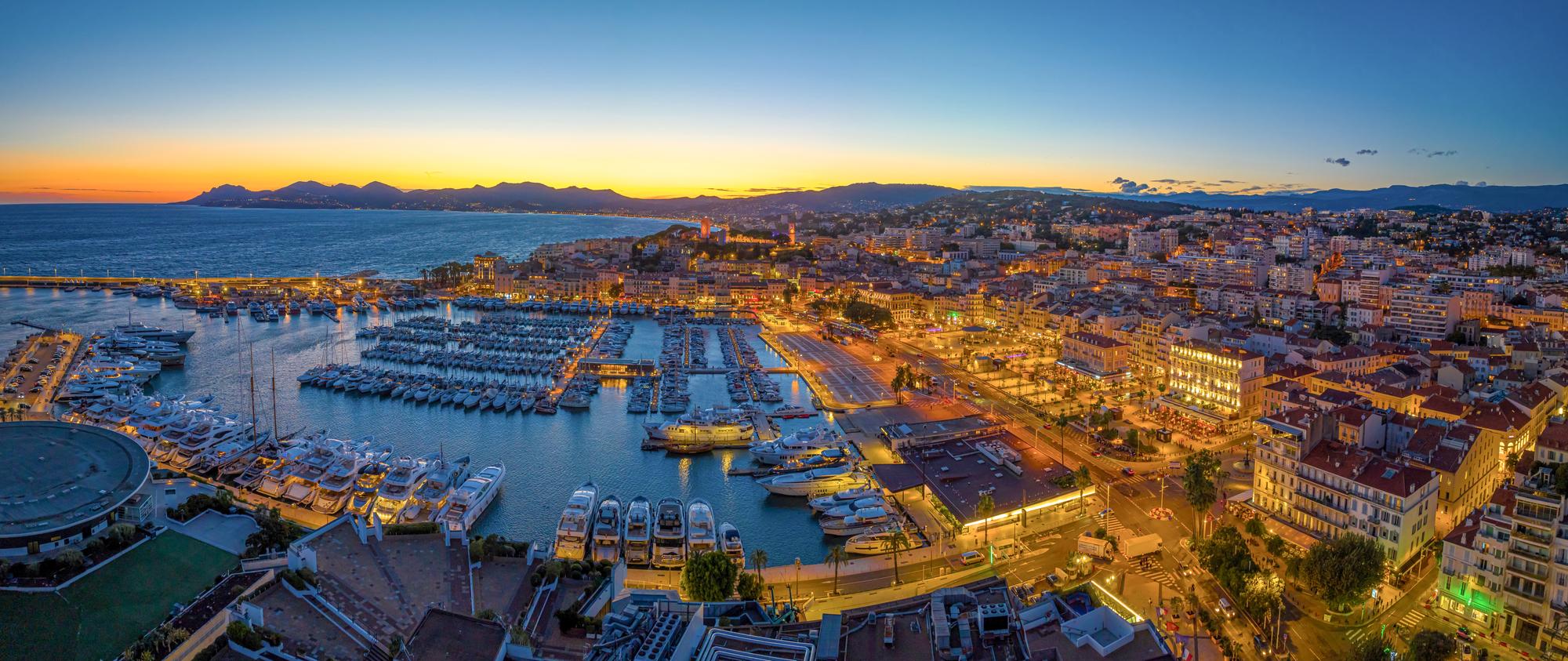 Enjoy a breathtaking aerial view of Cannes, France, a glamorous stop on the Mediterranean itinerary. | Cannes aerial view, Mediterranean France itinerary, French Riviera, Fraser Yachts | fraser