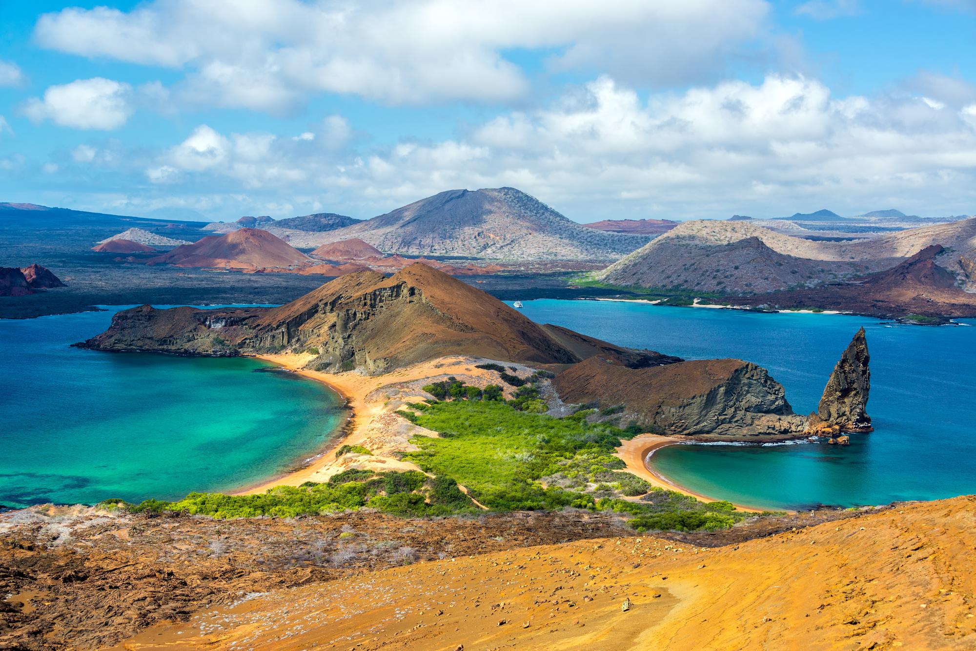 Discover the breathtaking coastline of Bartolomé Island in the Galapagos, featuring the iconic Pinnacle Rock and volcanic beauty | Coastline, Beautiful, Nature, Pinnacle Rock, Galapagos Islands, Volcanic | Fraser