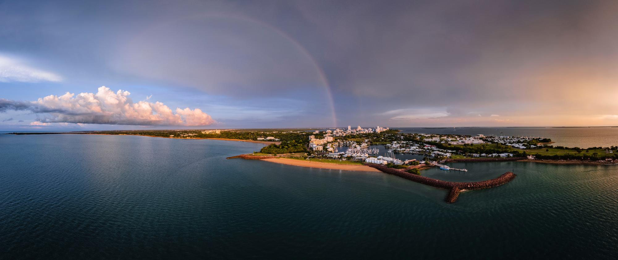 Explore the scenic beauty of Darwin Bay in the Galapagos with its panoramic coastline, pristine beach, and vibrant rainbow after the rain | Darwin Bay, Galapagos, Coast, Beach, Rainbow, Weather | Fraser