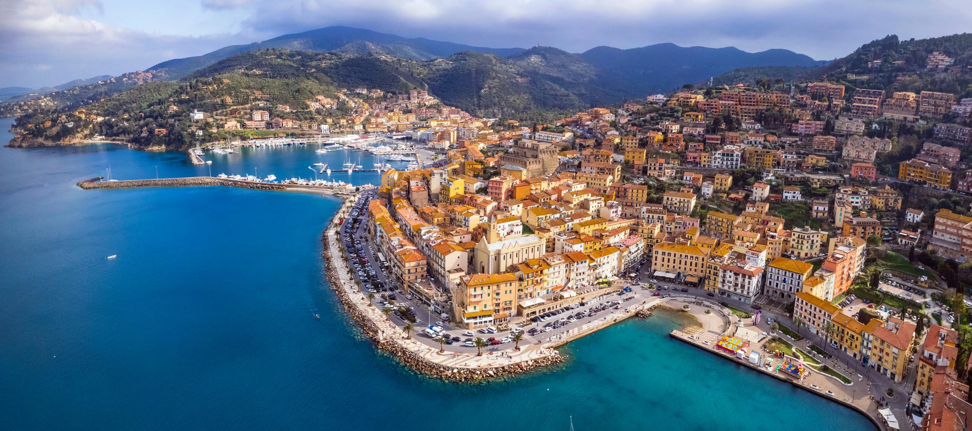 Embark on a journey to Porto Santo Stefano in Monte Argentario, Tuscany, Italy, a charming port town on the Mediterranean itinerary. | Tuscany, Monte Argentario, Porto Santo Stefano, Mediterranean Italy itinerary, Fraser Yachts | fraser