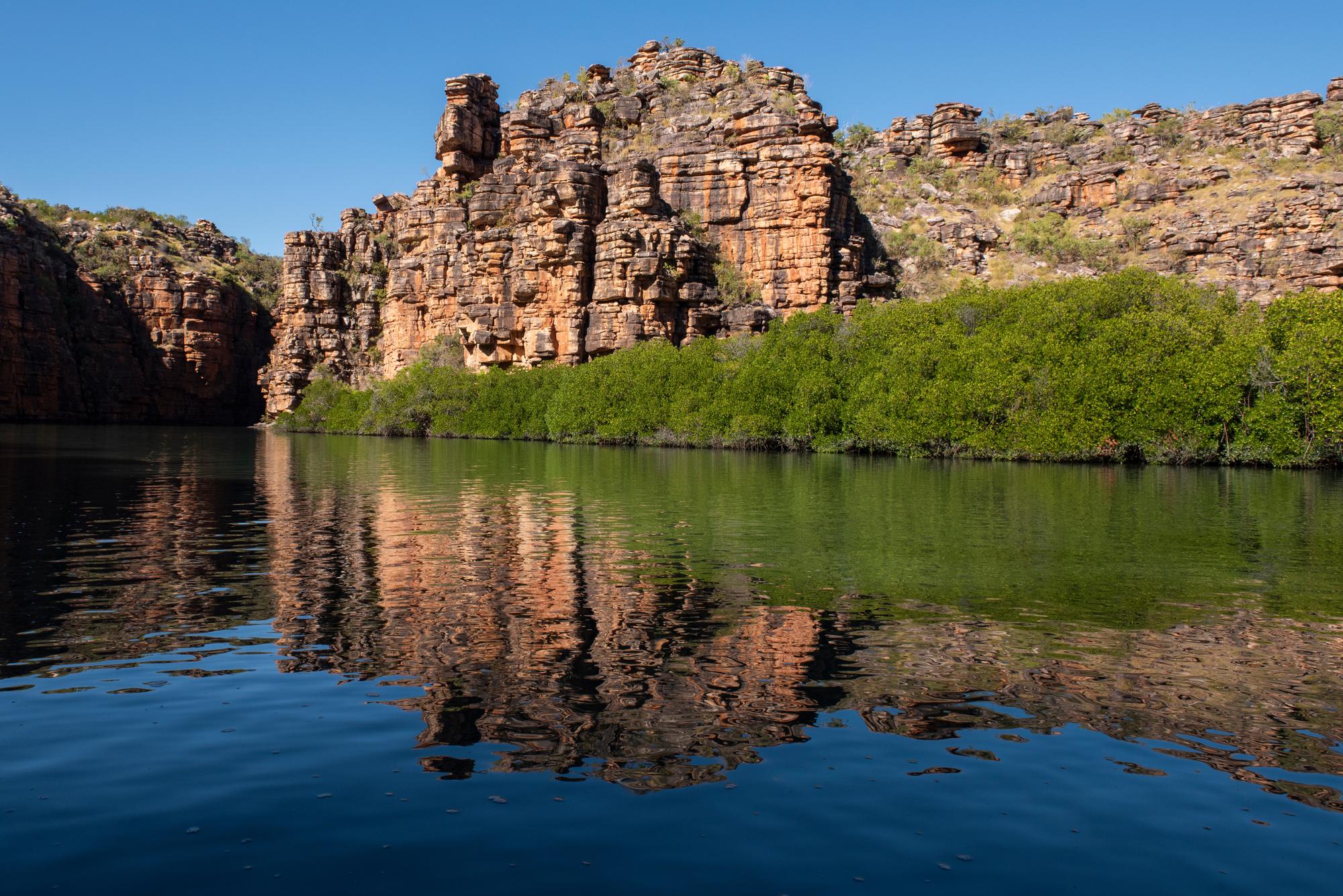 Experience Kimberley’s Koolama Bay: Idyllic reflections, colorful cliffs, and breathtaking views | Idyllic, Reflection, Cliff | Fraser