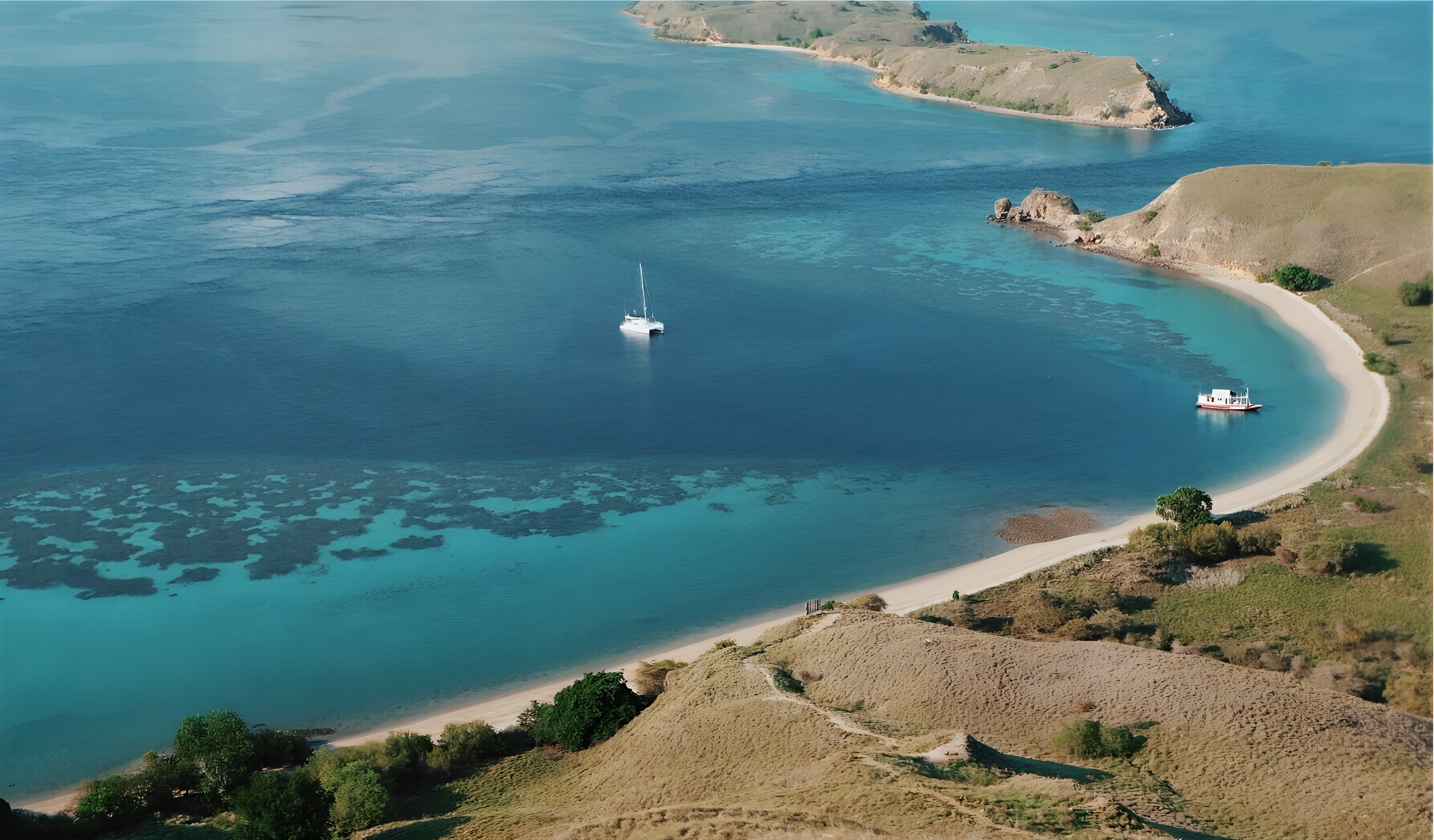Aerial view of Gili Banta near Labuan Bajo, Indonesia—pristine beaches and turquoise waters ideal for island hopping, snorkeling, and yacht anchorages in Komodo National Park | Fraser