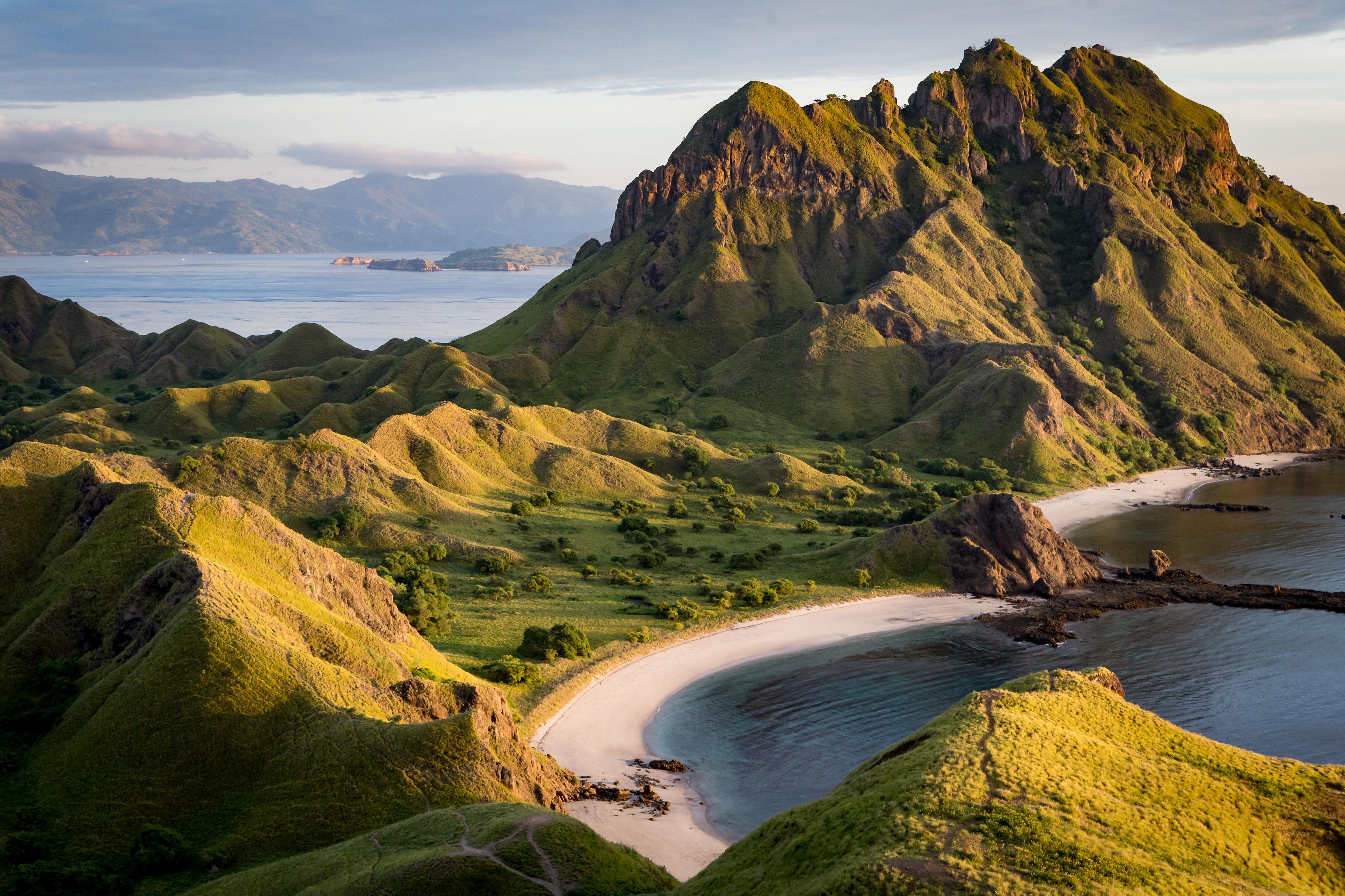 Scenic view of Gili Lawa Laut near Labuan Bajo, Indonesia—golden hills, iconic dive sites, and panoramic hikes across Komodo National Park’s remote island landscapes | Fraser