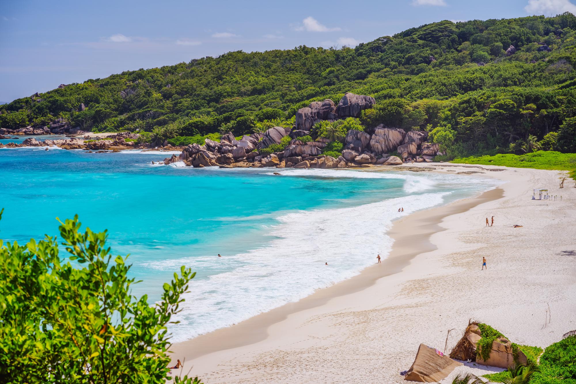 La Digue: Discover pristine sandy beaches with unique boulder formations, an ideal vacation destination. | Boulders, Destination, Formation, Pristine, Sandy Beach, Vacation, Seychelles | Fraser