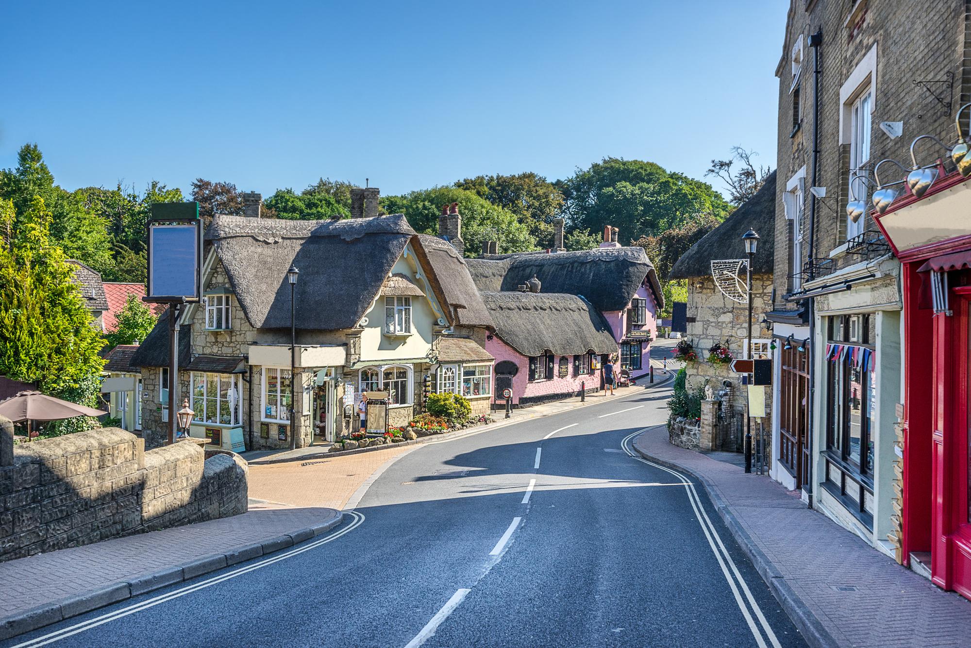 Explore the charming streets of Shanklin on the Isle of Wight, featuring quaint shops and picturesque views | Isle of Wight, Shanklin, Shops, Street, England | Fraser