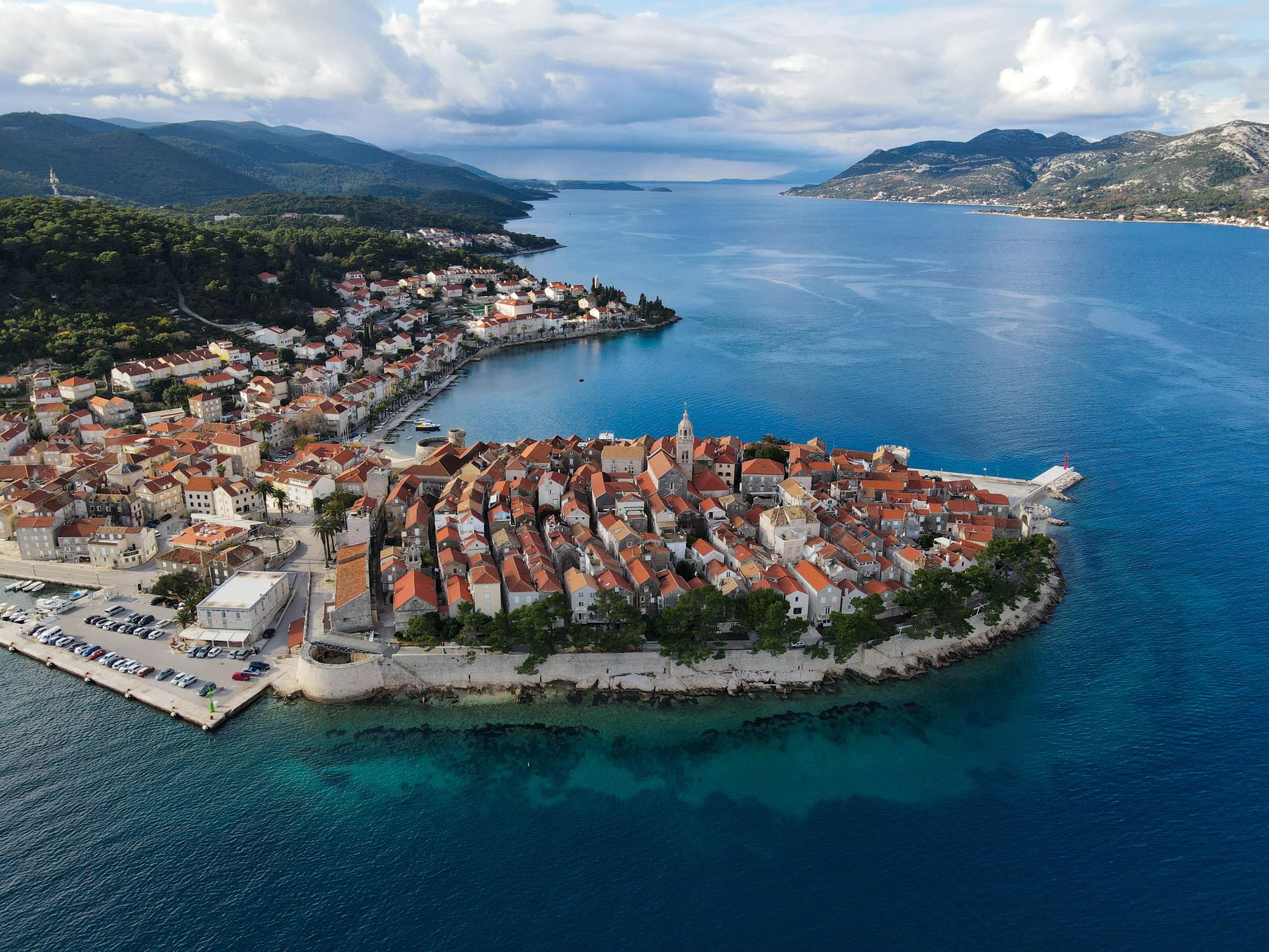 Explore the cultural and historical richness of Korcula, Croatia, from an aerial perspective, a popular destination for tourists | Aerial, culture, history, tourist, Korcula, Croatia | Fraser