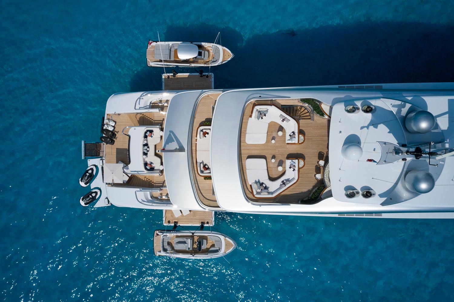 Enjoy panoramic views from the Arrow superyacht's deck with Fraser Yachts. | Arrow superyacht, luxury yacht, large deck, drone view, Fraser Yachts | FRASER